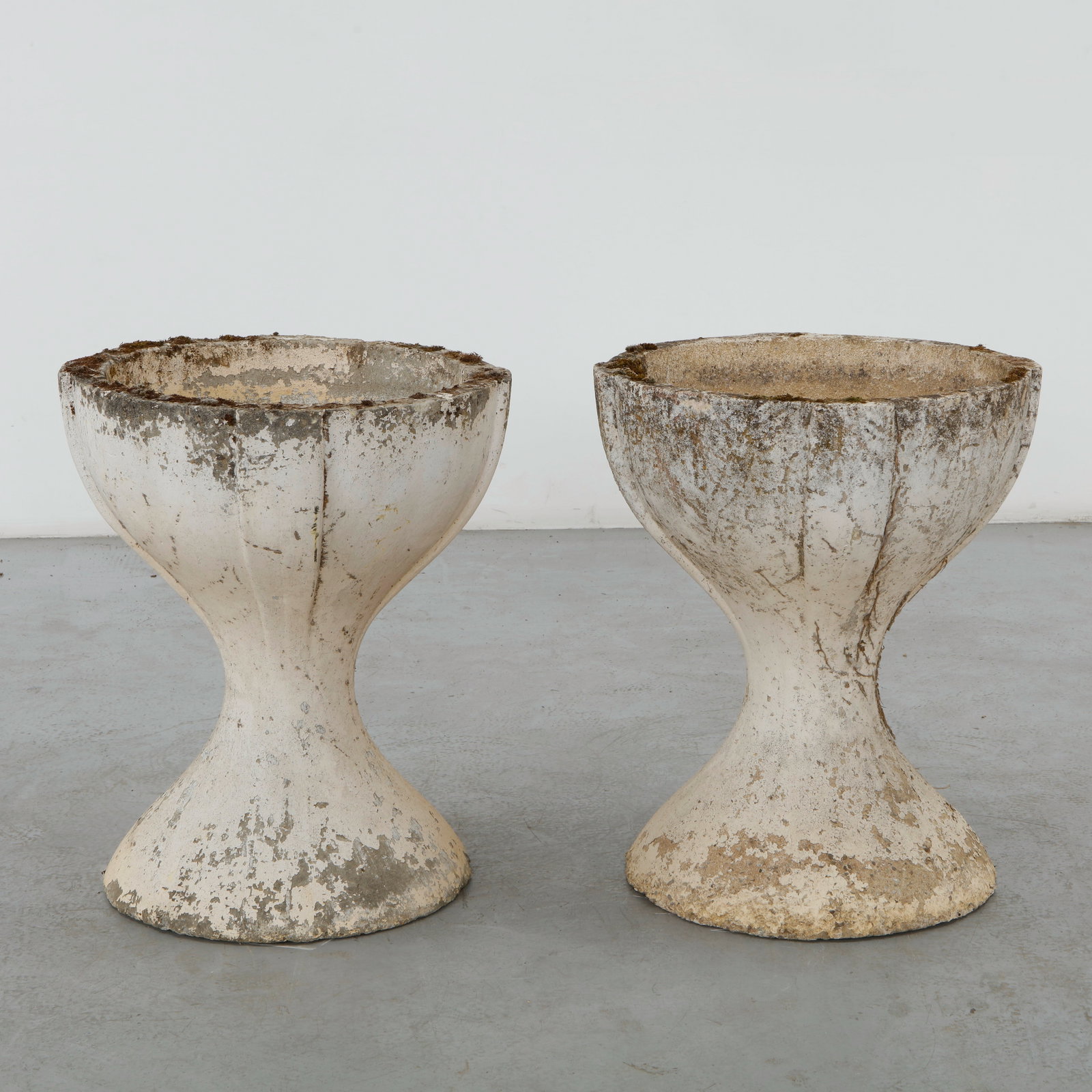Pair of Monumental Cast Stone Chalice Planters, 1960s: Monumental cast stone planters of elegant chalice form with fluted detailing and a beautifully weathered patina. A refined architectural design equally suited to classical and modern landscapes. Heigh