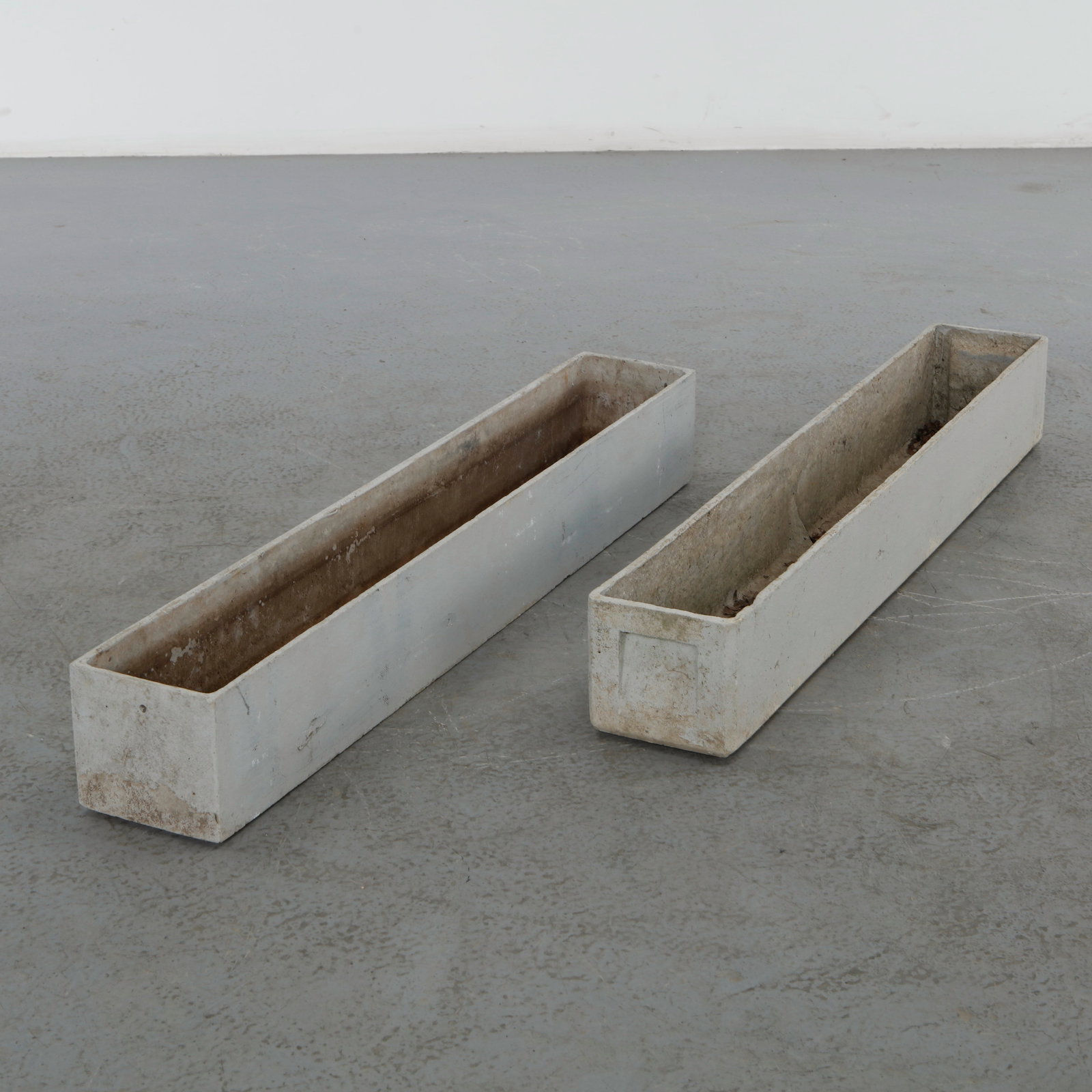 Willy Guhl, Pair of Rectangular Planters, 1960s: Classic rectangular Eternit planters designed by Willy Guhl. Timeless Swiss design with natural patina from outdoor use Height: 6 in. Length: 39 in. Width: 6 in.