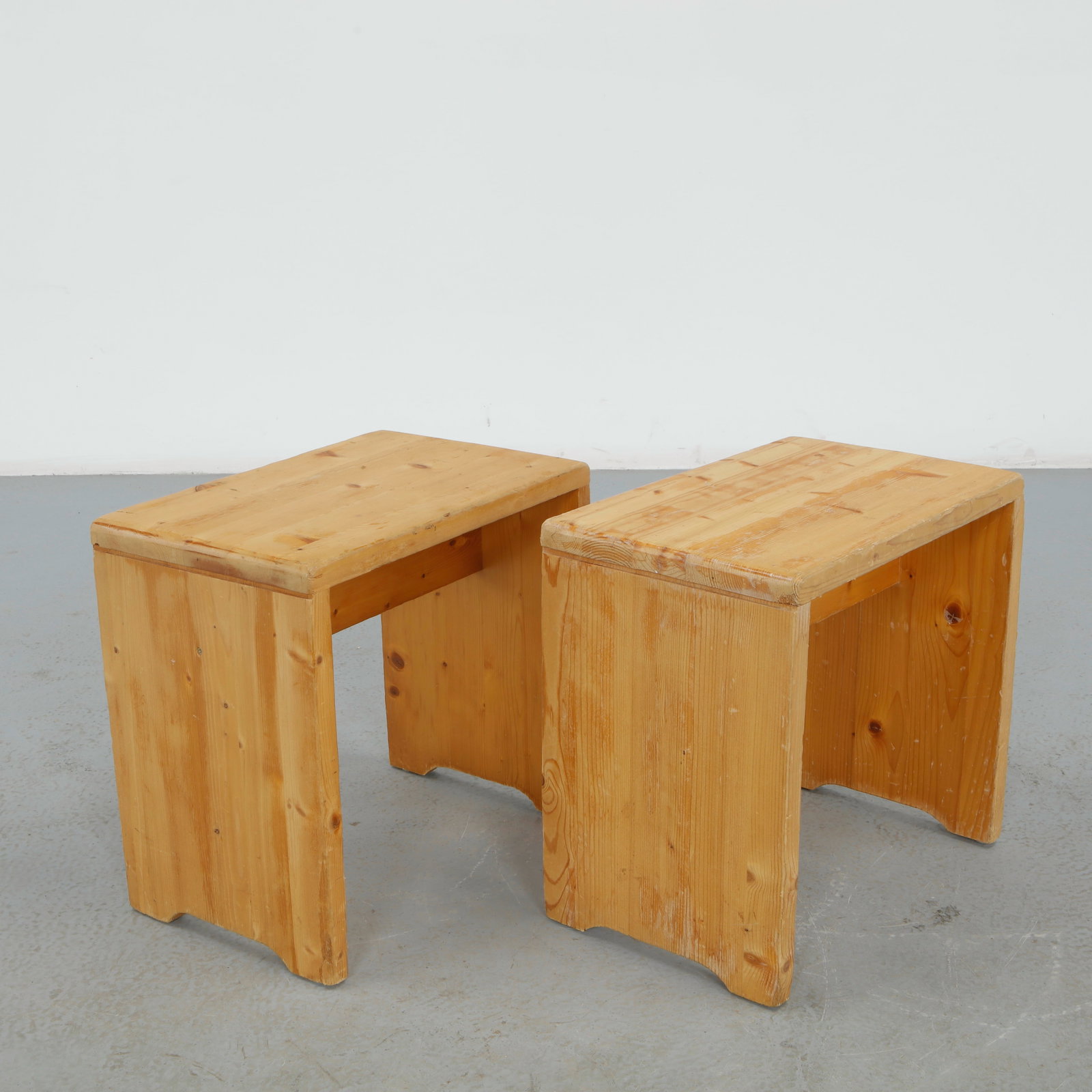 Charlotte Perriand for Les Arcs 1600, Pair of Pine Stools, 1960s: Executed in solid pine with clean architectural lines characteristic of the Les Arcs resort interiors. The restrained construction and warm patina reflect Perriand functional approach to alpine furnit