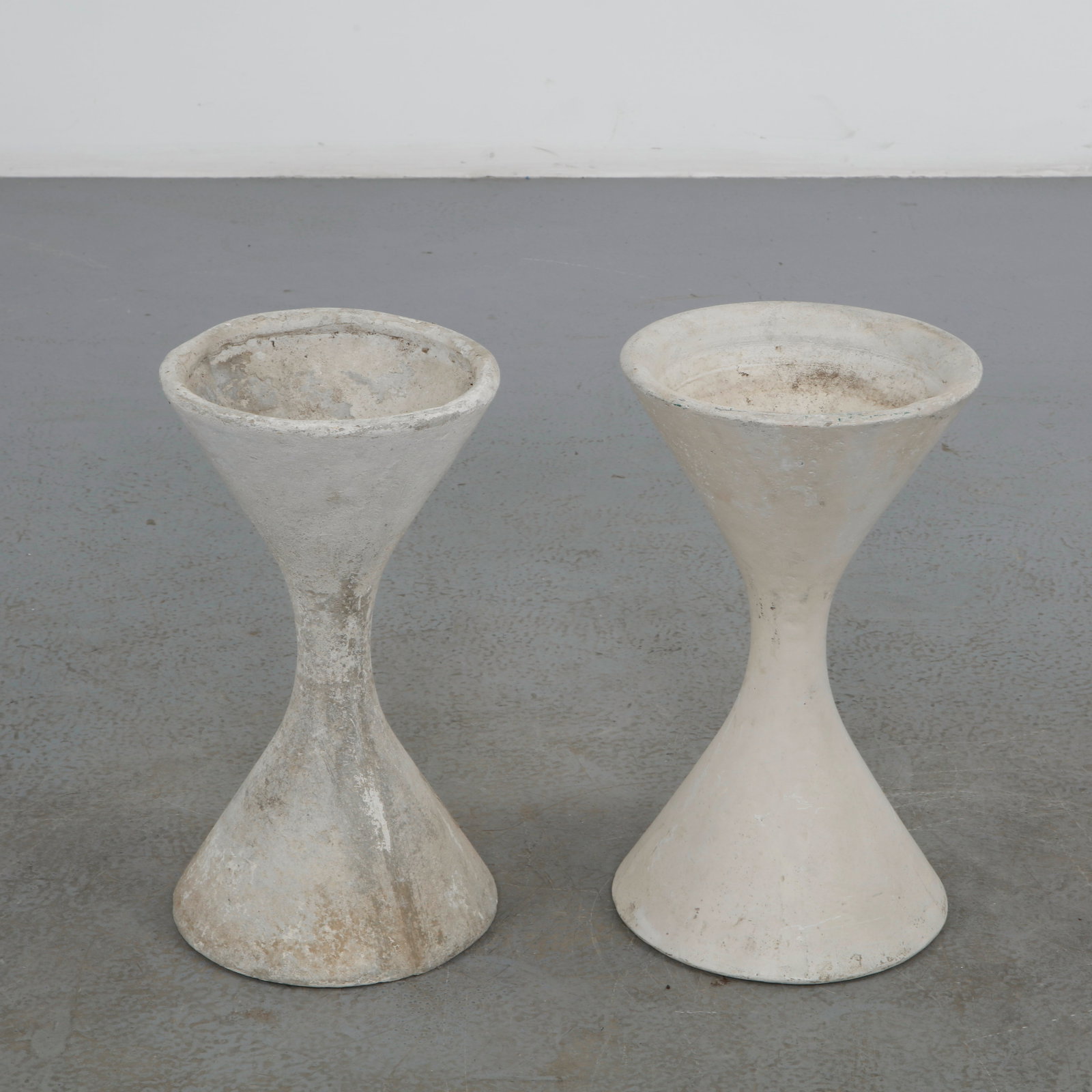 Willy Guhl, Pair of Extra Small Diabolo Planters, 1960: Pair of Willy Guhl extra small diabolo planters manufactured by Eternit, Switzerland. Height: 19 in. Diameter: 11 in.