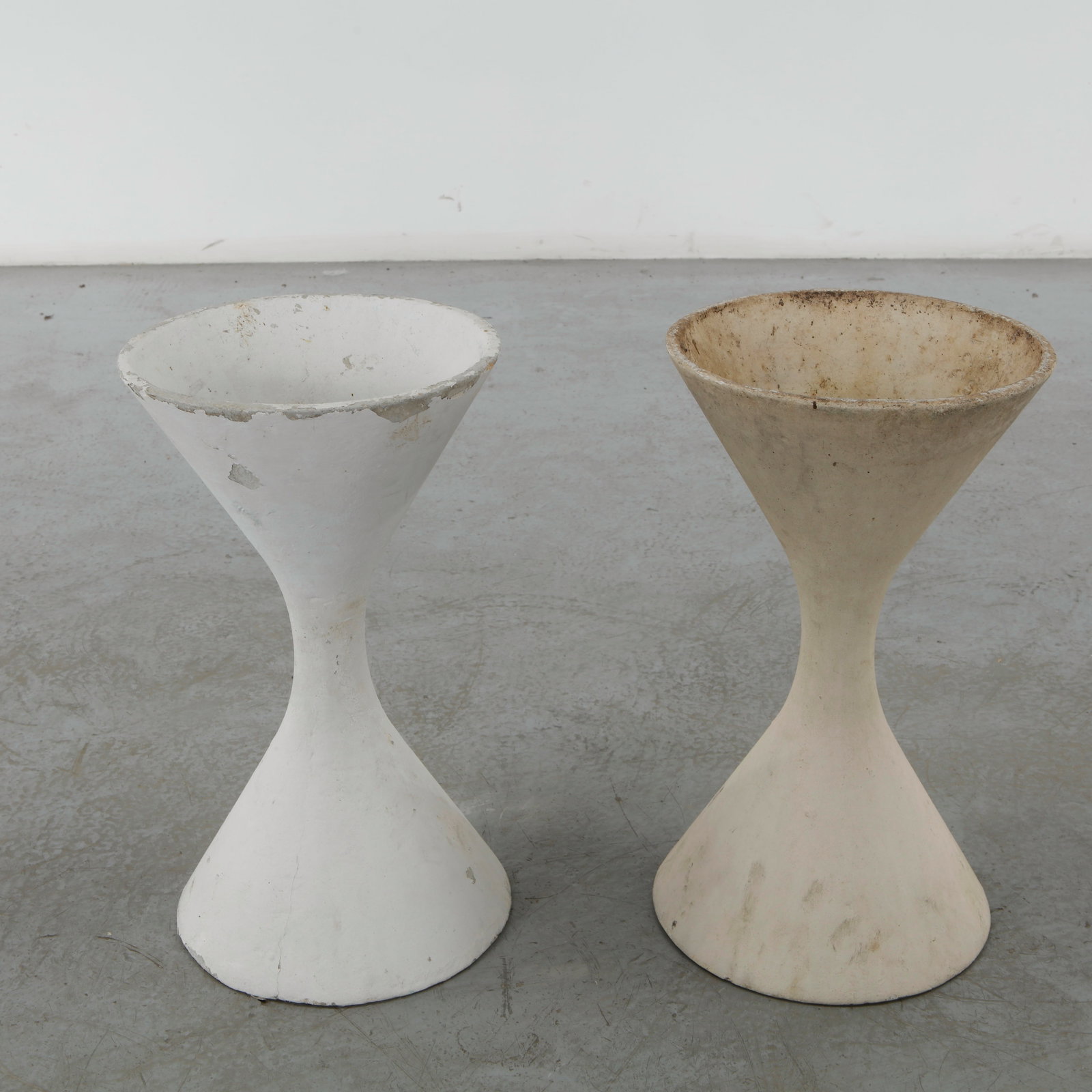 Willy Guhl, Pair of Extra Small Diabolo Planters, 1960s: Pair of Willy Guhl extra small diabolo planters manufactured by Eternit, Switzerland. Height: 19 in. Diameter: 11 in.