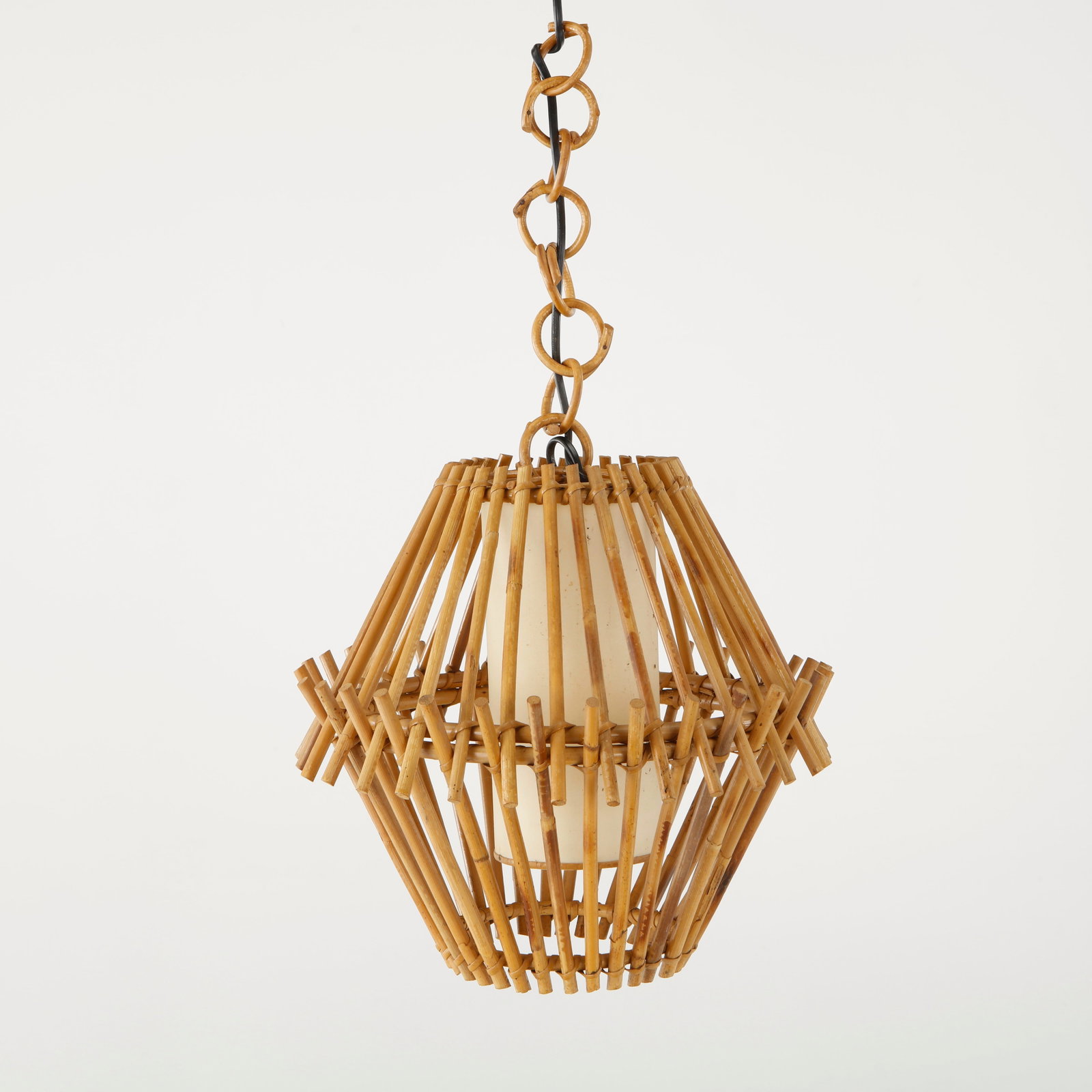 Louis Sognot, Bamboo Hexagonal Pendant Light, France, 1950s: Executed in bent bamboo with a softly diffused parchment interior, this geometric pendant balances sculptural form with natural warmth. A sophisticated expression of French mid-century craftsmanship.