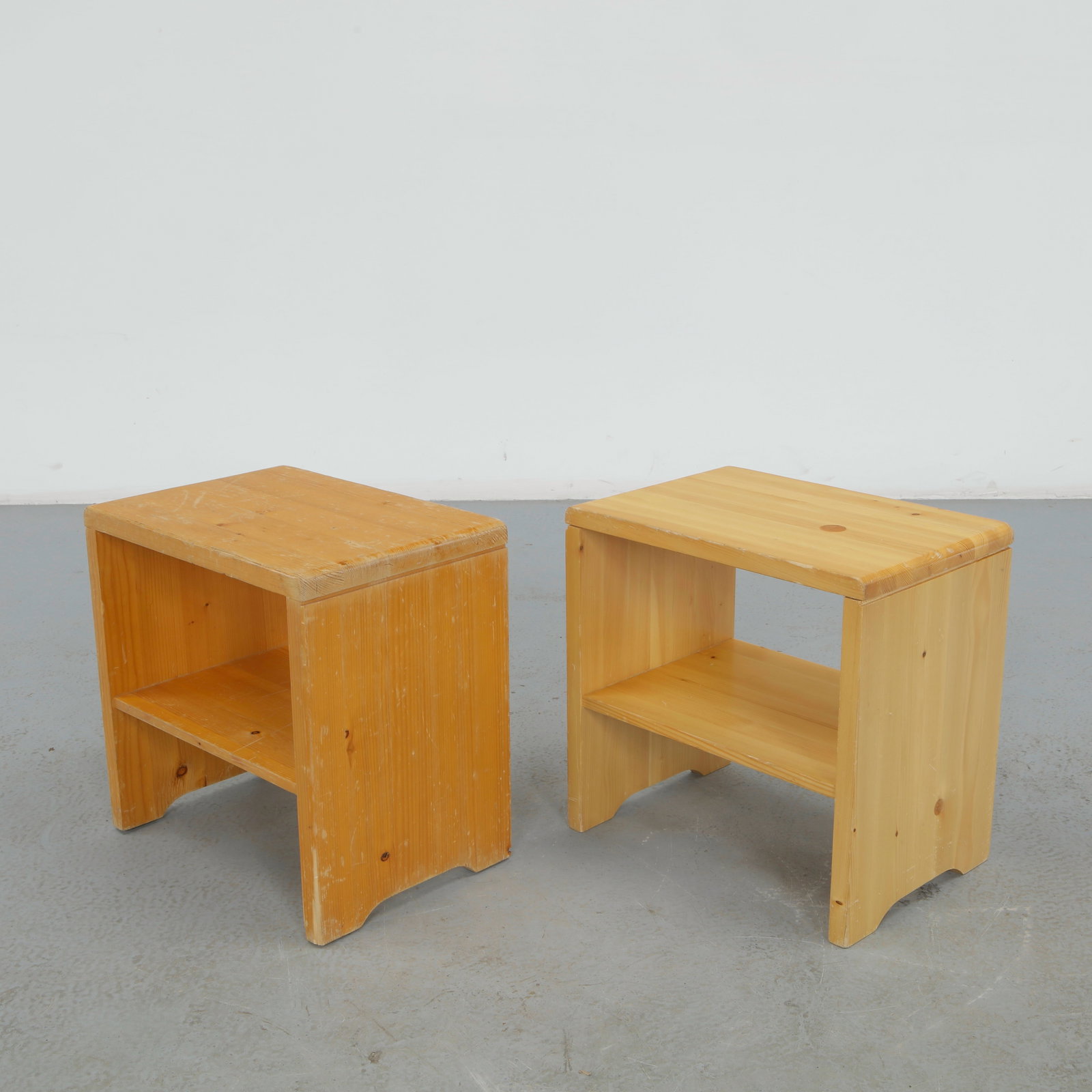Charlotte Perriand for Les Arcs 1600, Pair of Pine Nightstand, 1960s: This pair of nightstands is constructed from solid pine, each with an open shelf below a flat top. Pale, warm grain and unadorned construction reflect Perriand's furnishings for Les Arcs 1600. Height: