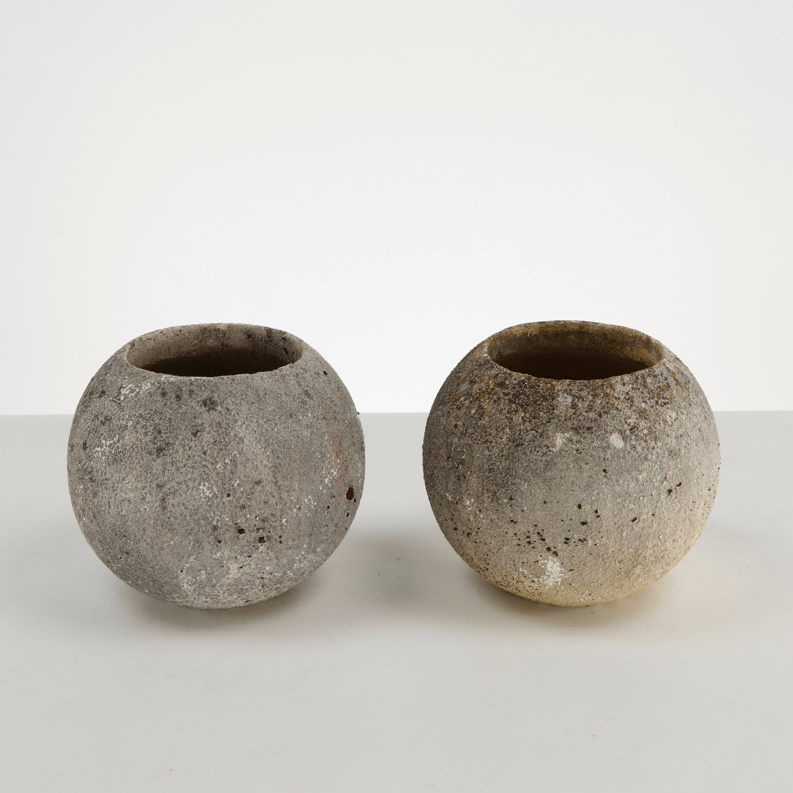 Grandon Fres, Pair of Spherical Planters, 1960s: Pair of classic spherical shaped planters by Grandon Fres. Each displays subtle variations in surface texture and tone from age. Height: 11.5 in. Diameter: 12.5 in. Opening Diameter: 7.5 in.