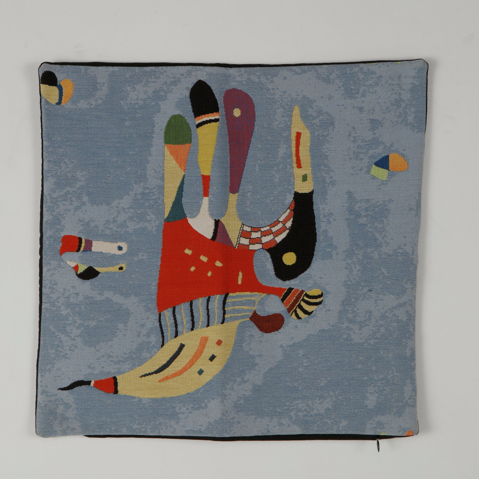 Wassily Kandinsky, Pillow Cover for the Pompidou Center: Decorative woven pillow cover produced for the Centre Pompidou, featuring one of Wassily Kandinsky celebrated abstract compositions. Richly woven with vibrant colors and intricate detailing, it transl