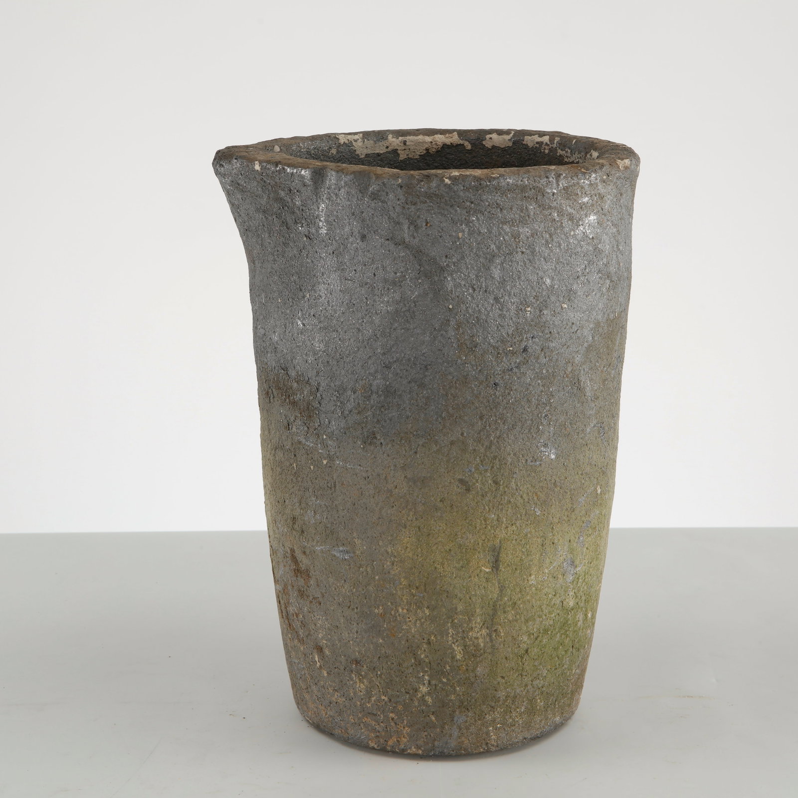 Small Foundry Pot, France, 1960s: A small cast iron foundry pot featuring a tapered cylindrical silhouette and an authentic industrial patina acquired through years of use. Originally intended for foundry applications, it has since be