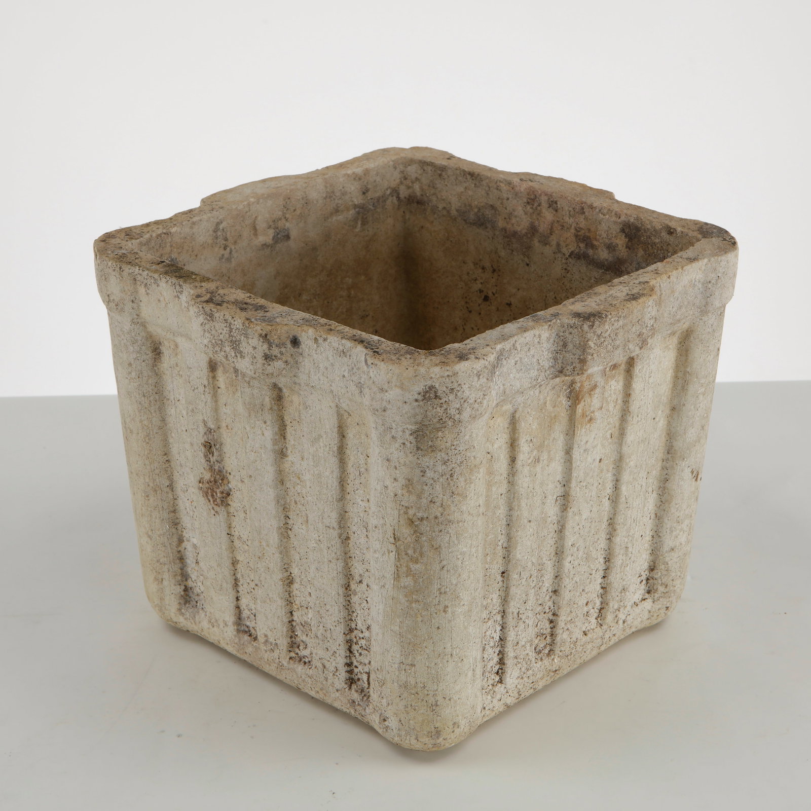 Willy Guhl, Small Square Planter, 1960s: A compact square planter designed by Willy Guhl, executed in fiber cement with the designer signature architectural lines and integrated side handles. Its restrained geometry and naturally weathered s
