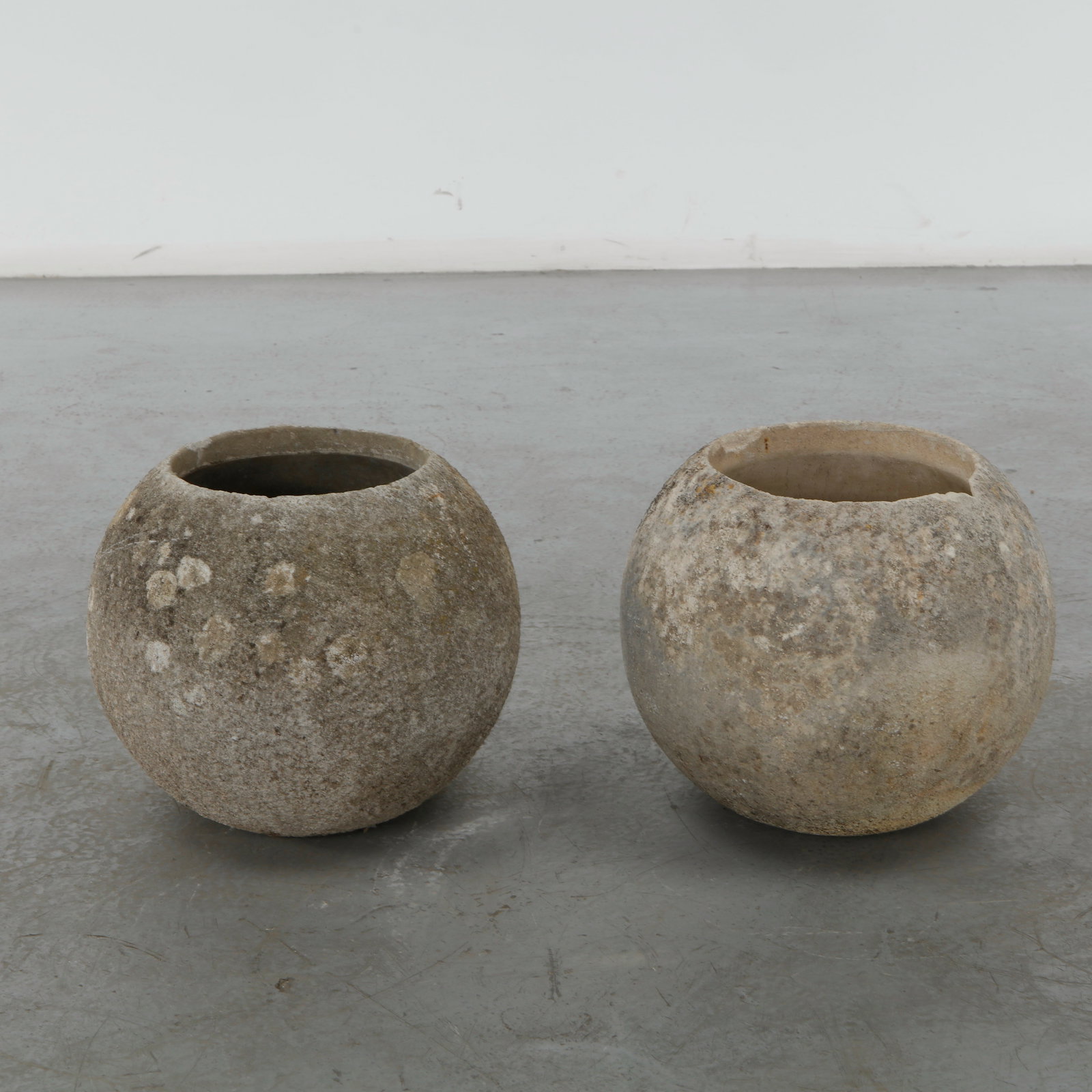 Grandon Fres, Pair of Large Spherical Planters, 1960s: Pair of large spherical shaped planters by Grandon Fres. Each displays subtle variations in surface texture and tone from age. Height: 14.5 in. Diameter: 17 in. Opening Diameter: 9.5 in