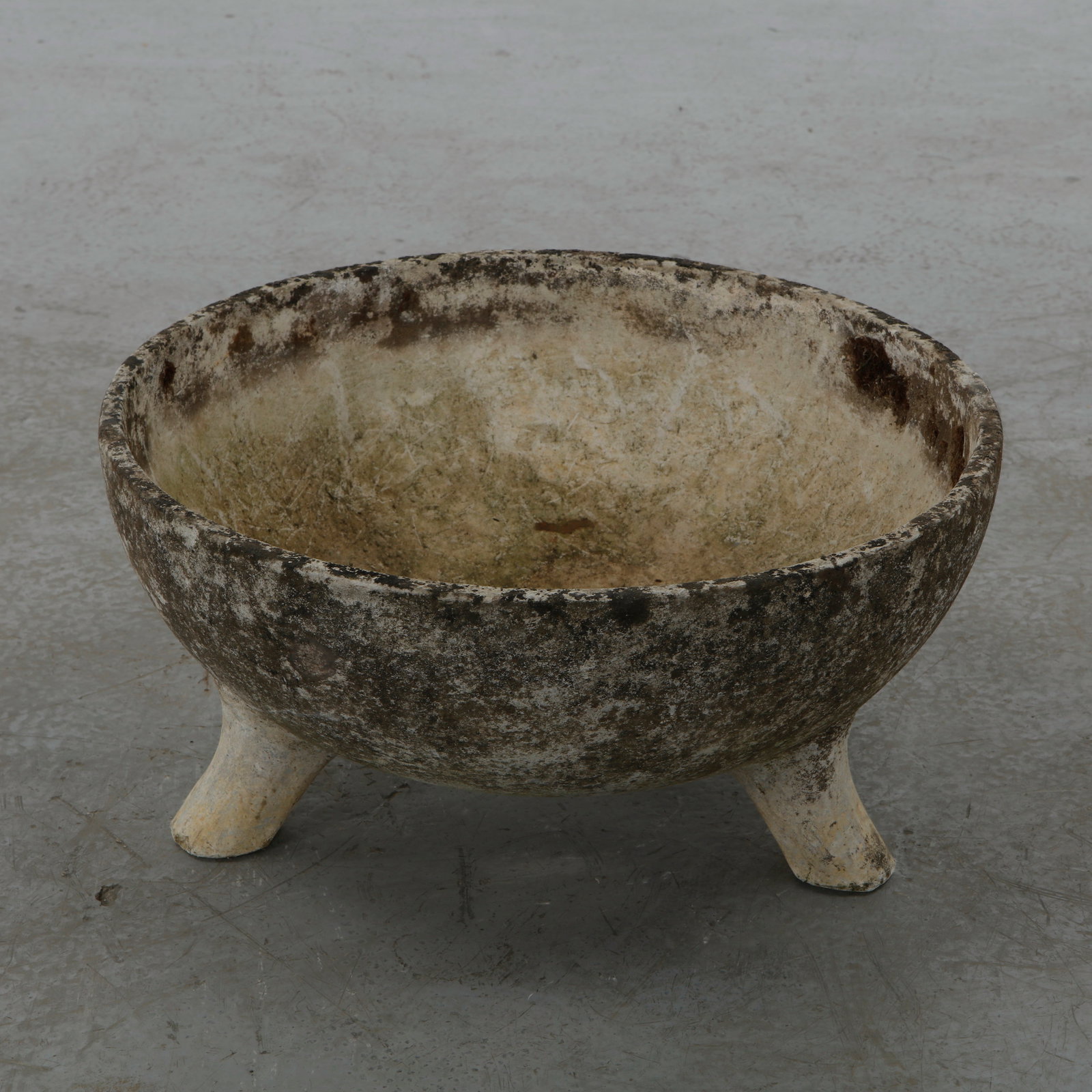 Willy Guhl, Half Cauldron Planter, 1960s: A sculptural half cauldron shaped planter by Swiss designer Willy Guhl for Eternit, 1960s. Resting on three feet, its compact form and beautifully weathered patina offer both charm and architectural
