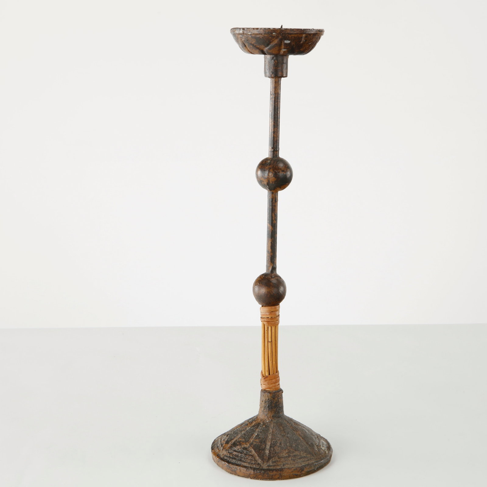 Brutalist Metal Candlestick, France, 1960s: Executed in cast and wrought metal with sculptural spherical details and a finely textured circular base, this candlestick embodies the expressive simplicity of the French Brutalist movement. A