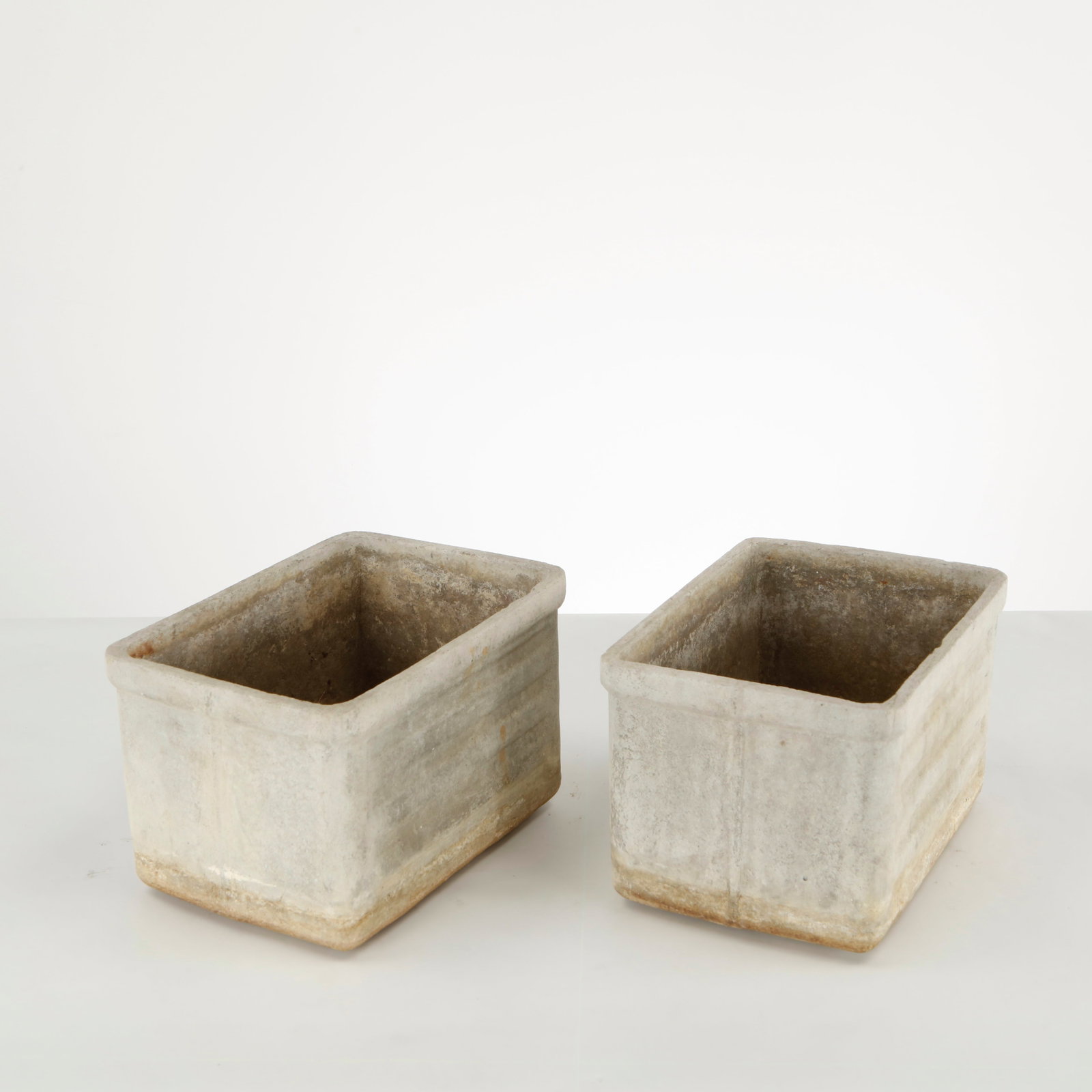 Willy Guhl, Pair of Rectangular Planters, 1960s: Crafted in fiber cement by Eternit, this pair of rectangular planters reflects Willy Guhl understated approach to functional modernism. Their clean architectural forms and naturally weathered surfaces