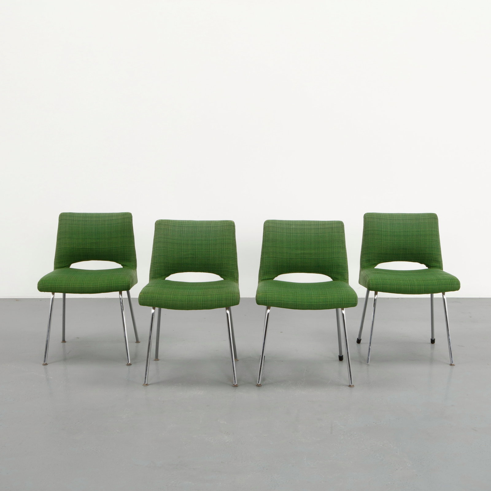 Georges Frydman, Four Green Fabric Chairs, 1970s: Set of four upholstered chairs by Georges Frydman featuring curved silhouettes and chromed metal legs. The vivid green fabric upholstery contrasts elegantly with the light structure, reflecting the re