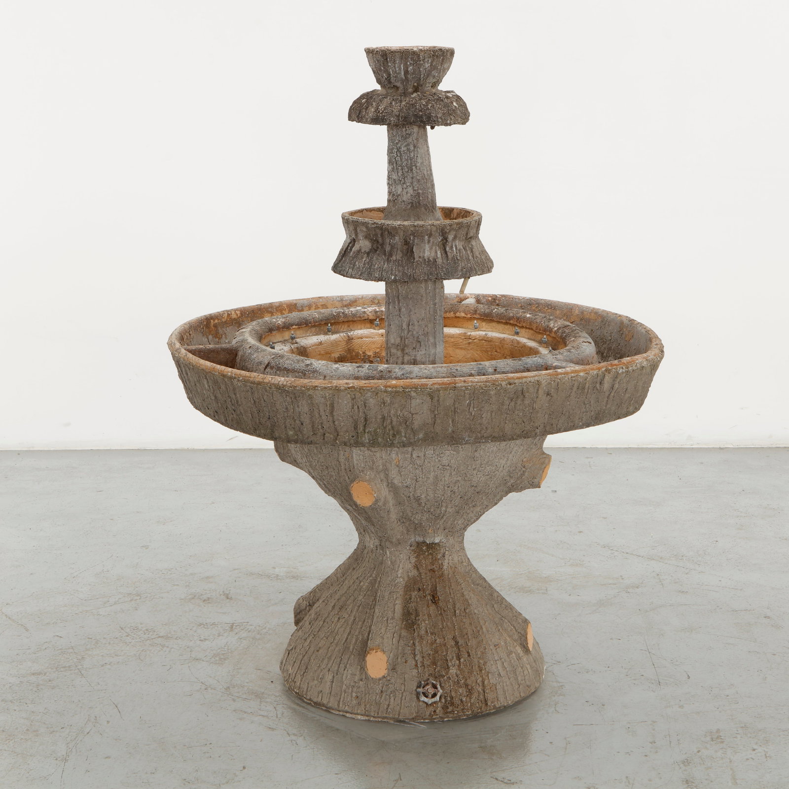 Monumental Faux Bois Fountain, 1960s: Executed in molded concrete with a bark-like texture, this multi-tier garden fountain reflects the organic vocabulary of faux bois craftsmanship. The stacked basins and sculptural form create a
