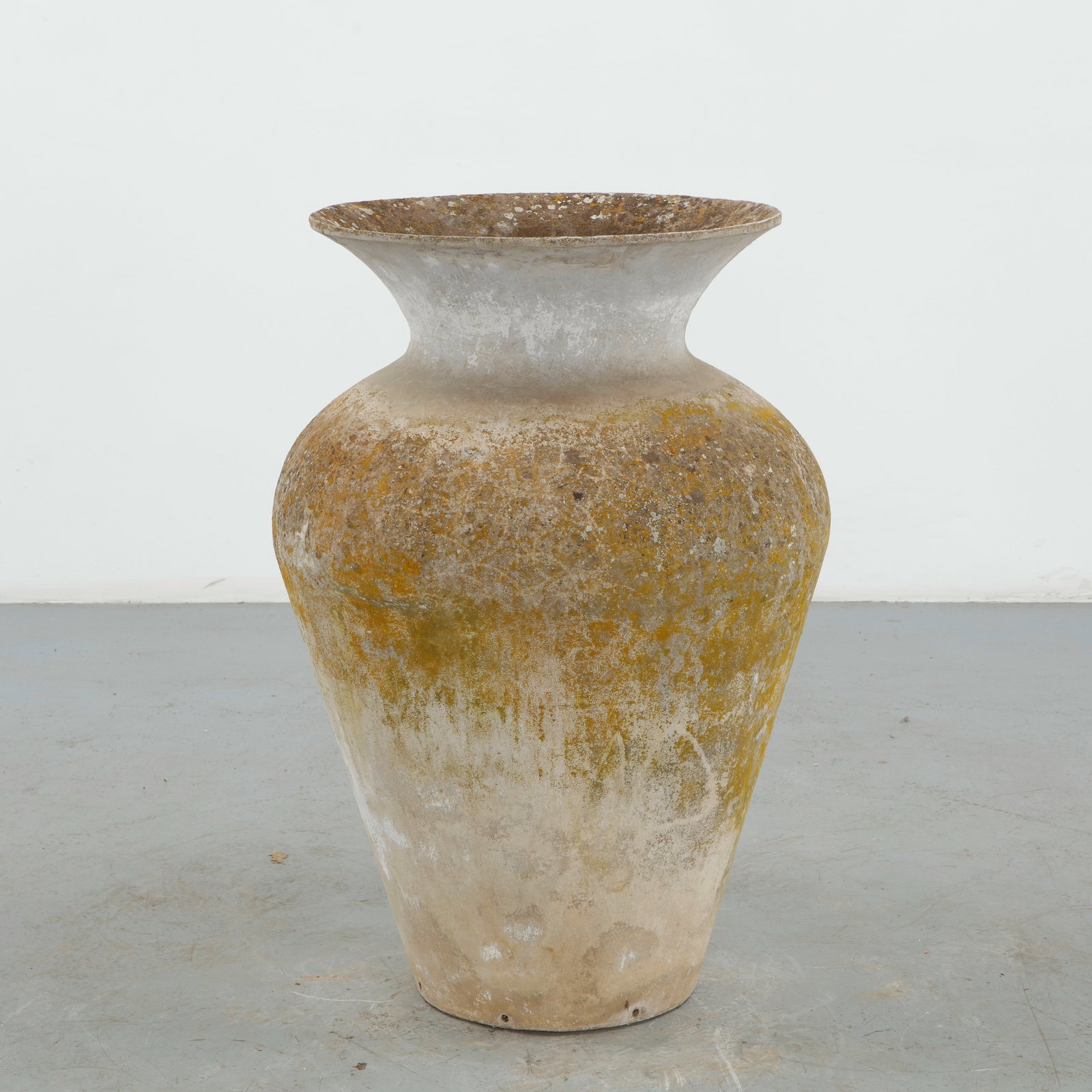 Willy Guhl, Monumental Jar Planter, 1960s: A monumental jar-form planter by Willy Guhl, featuring a generously rounded body, elegantly narrowed neck, and broad, subtly flared rim. The naturally weathered concrete surface lends the restrained