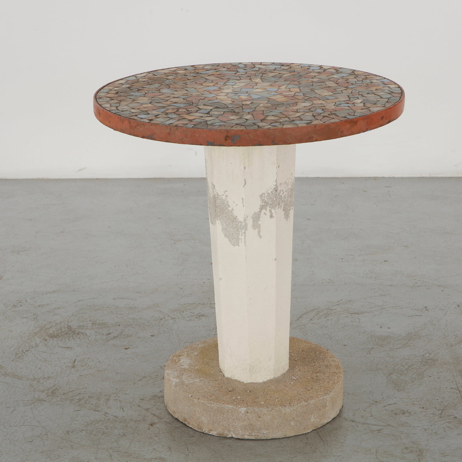 Mosaic Pedestal Side Table with Circular Top, 1960s: A compact outdoor side table with a circular mosaic top supported by a cylindrical concrete pedestal. Its subdued palette and extensively weathered finish lend the piece a distinctive Mediterranean