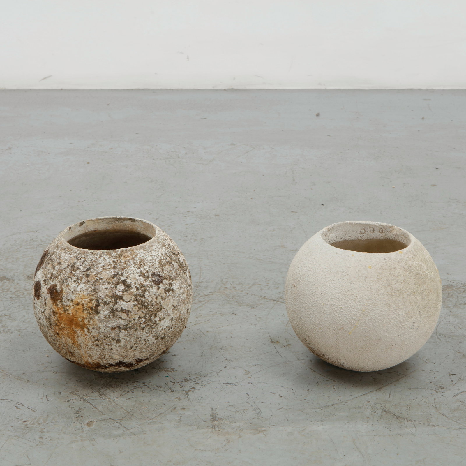 Grandon Fres, Pair of Small Spherical Planters, 1960s: Pair of classic spherical shaped planters by Grandon Fres. Each displays subtle variations in surface texture and tone from age. Height: 9.5 in. Diameter: 9 in. Opening Diameter: 5.5 in.