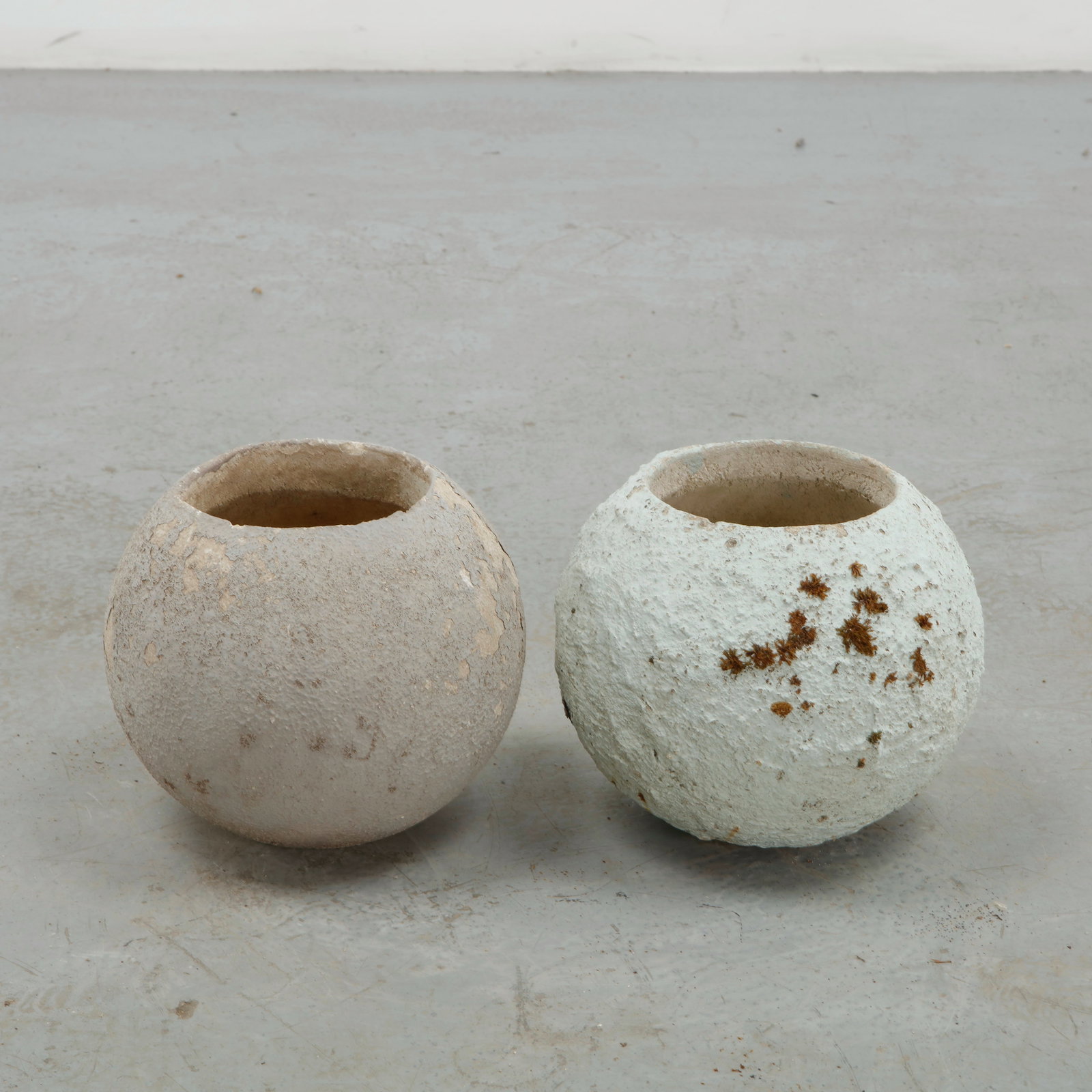 Grandon Fres, Pair of Small Spherical Planters, 1960s: Pair of classic spherical shaped planters by Grandon Fres. Each displays subtle variations in surface texture and tone from age. Height: 9.5 in. Diameter: 9 in. Opening Diameter: 5.5 in.