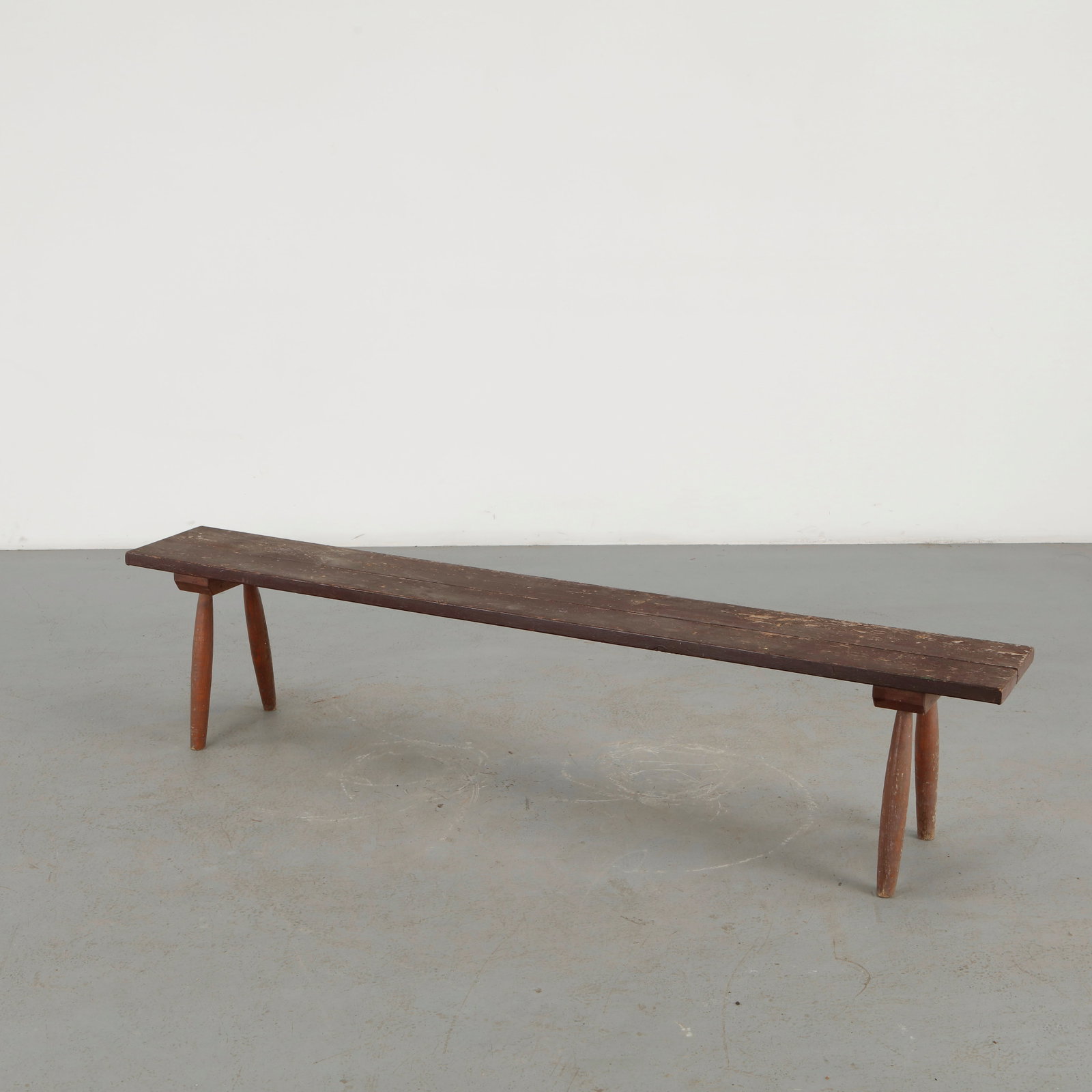 French Rustic Wood Bench, 1960s: A substantial French rustic bench crafted in solid wood, distinguished by its thick, naturally aged plank seat and restrained trestle construction. The pronounced grain, irregularities, and accumulate