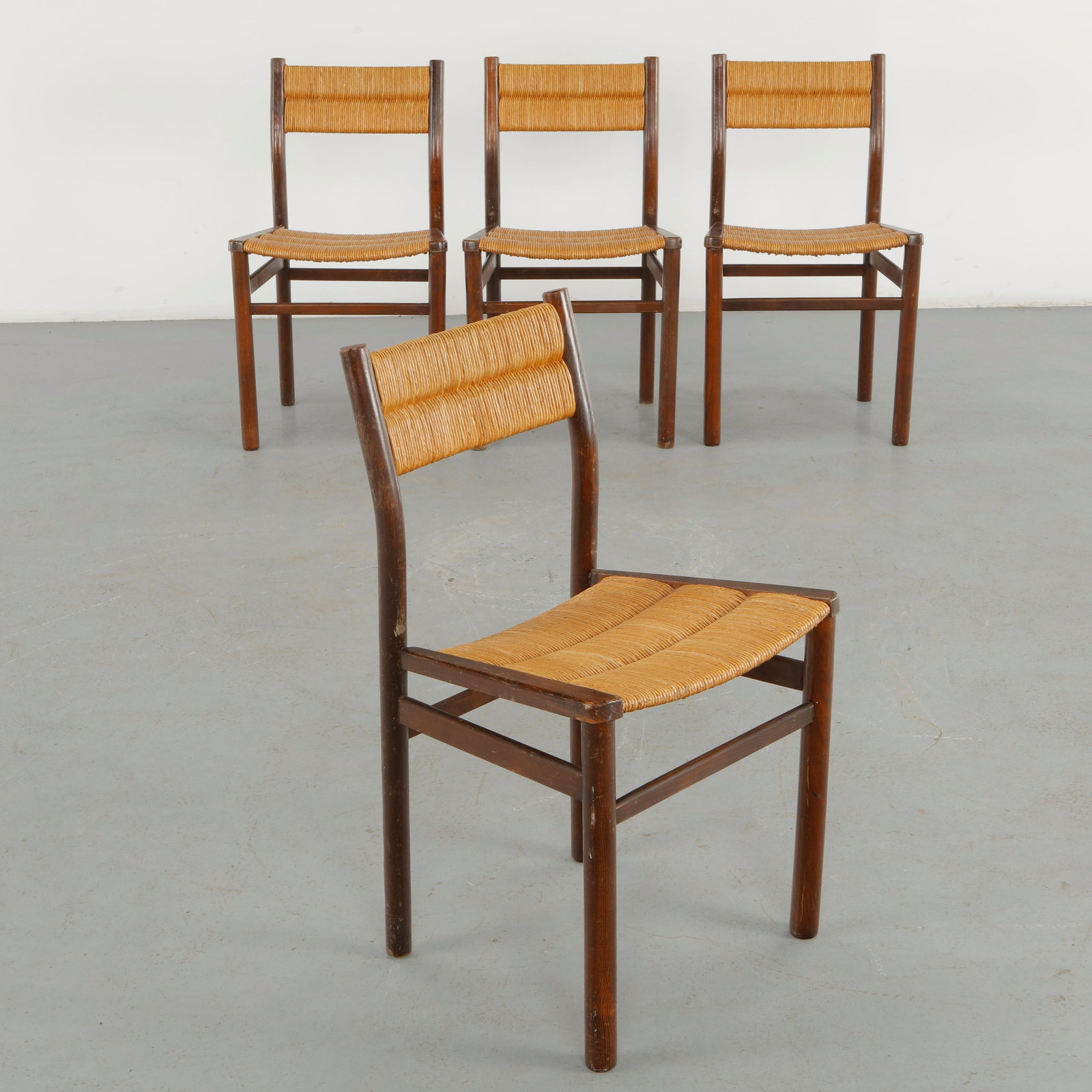 Pierre Gauthier Delaye, Set of Four Weekend Chairs, 1960s: A set of four sculptural wooden chairs by Pierre Gauthier Delaye, distinguished by their undulating ladder backs, and woven rope seats. The carefully articulated profiles transform a traditional chair