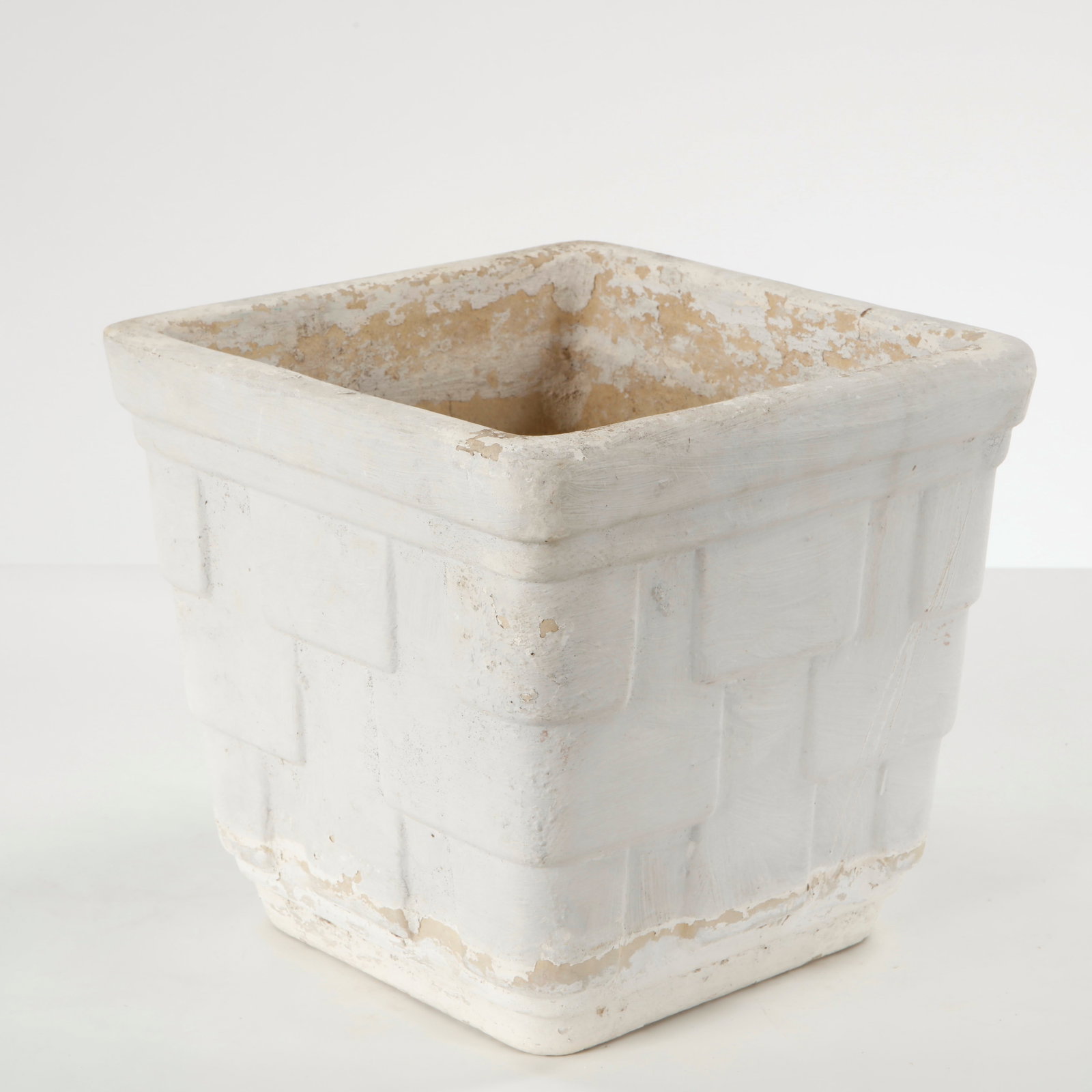 Small Square Concrete Planter, 1960s: Cast in concrete with a restrained geometric profile, this square planter features subtle relief detailing and a softly weathered surface. Its clean proportions and natural patina exemplify mid-centur