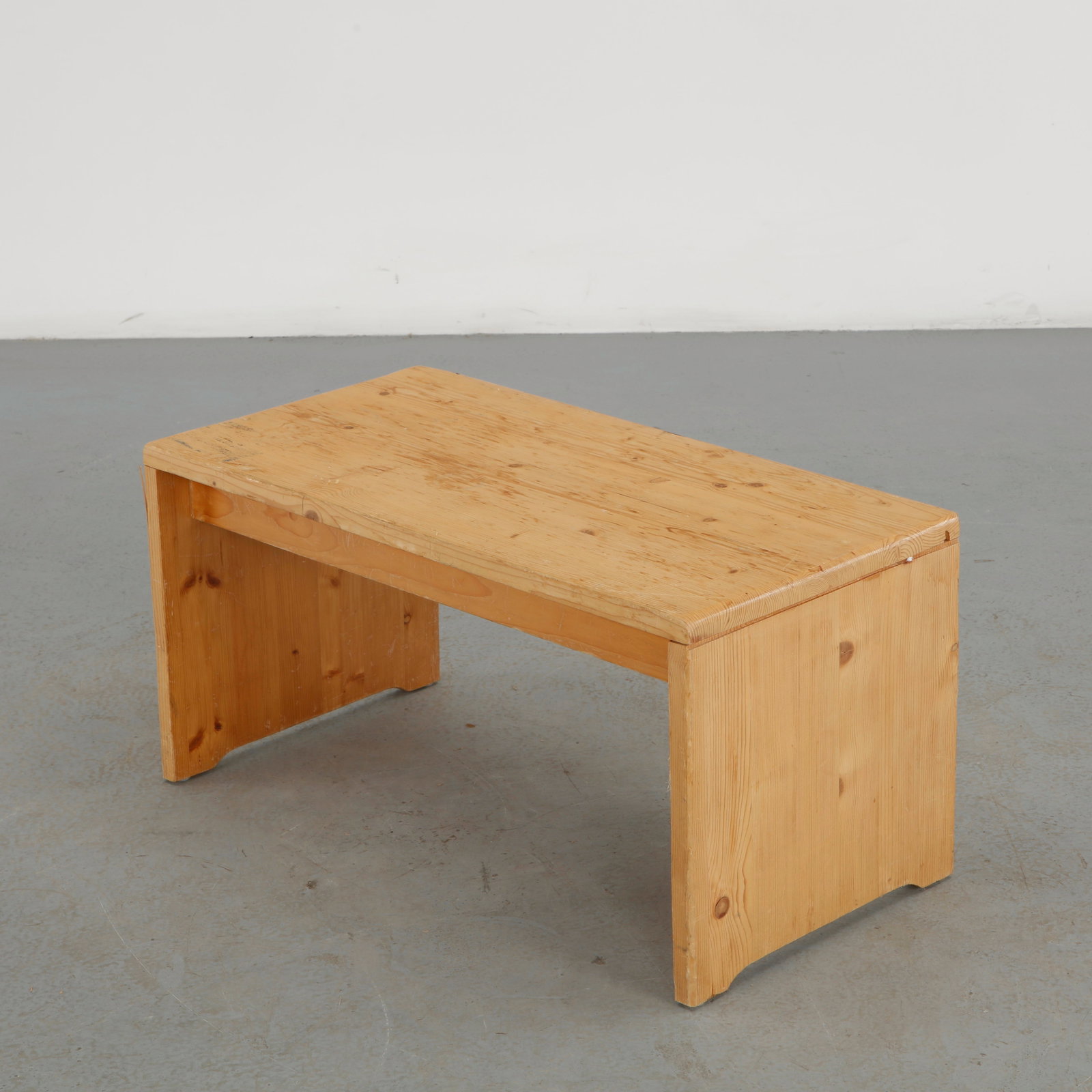 Charlotte Perriand for Les Arcs 1600, Large Pine Bench, 1960s: Executed in solid pine, this substantial bench features a broad plank seat supported by simple slab-form end supports. The warm, expressive grain and restrained construction exemplify Perriand functio