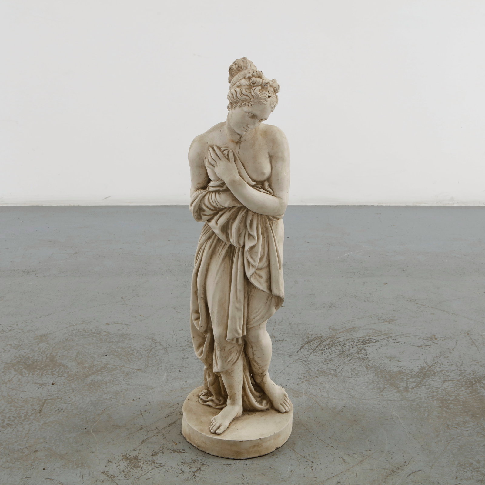 Draped Woman Sculpture, 1960s: Classically inspired female figure executed in cast stone, presented in a graceful contrapposto pose with finely articulated drapery. The restrained finish and softly weathered surface evoke the