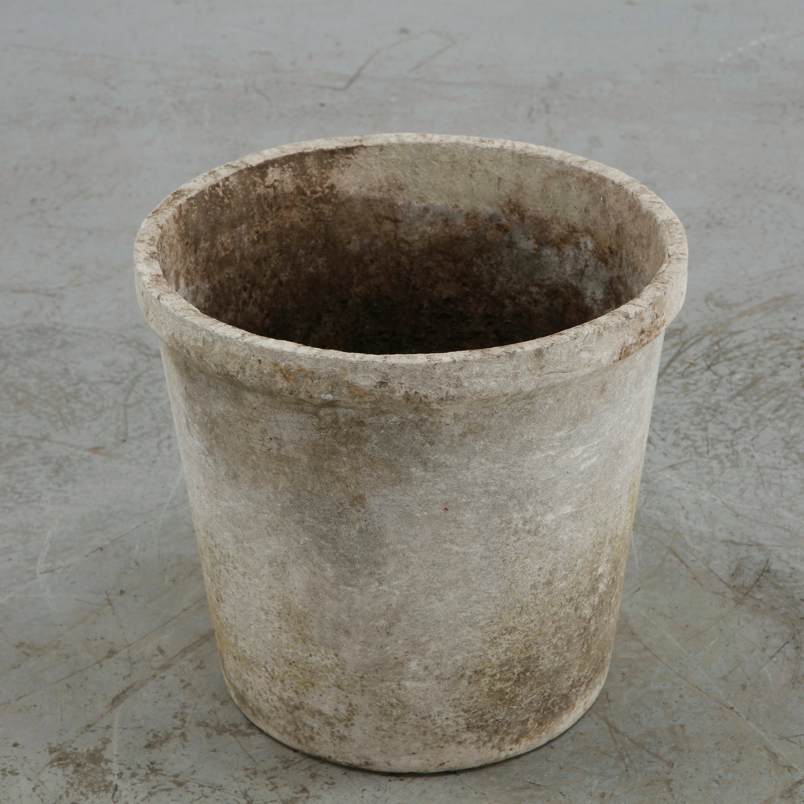 Willy Guhl, Round Planter, 1960s: Executed in concrete, this cylindrical planter exemplifies Willy Guhl disciplined approach to outdoor design, combining a generous profile with a softly rounded rim and restrained geometric form. The