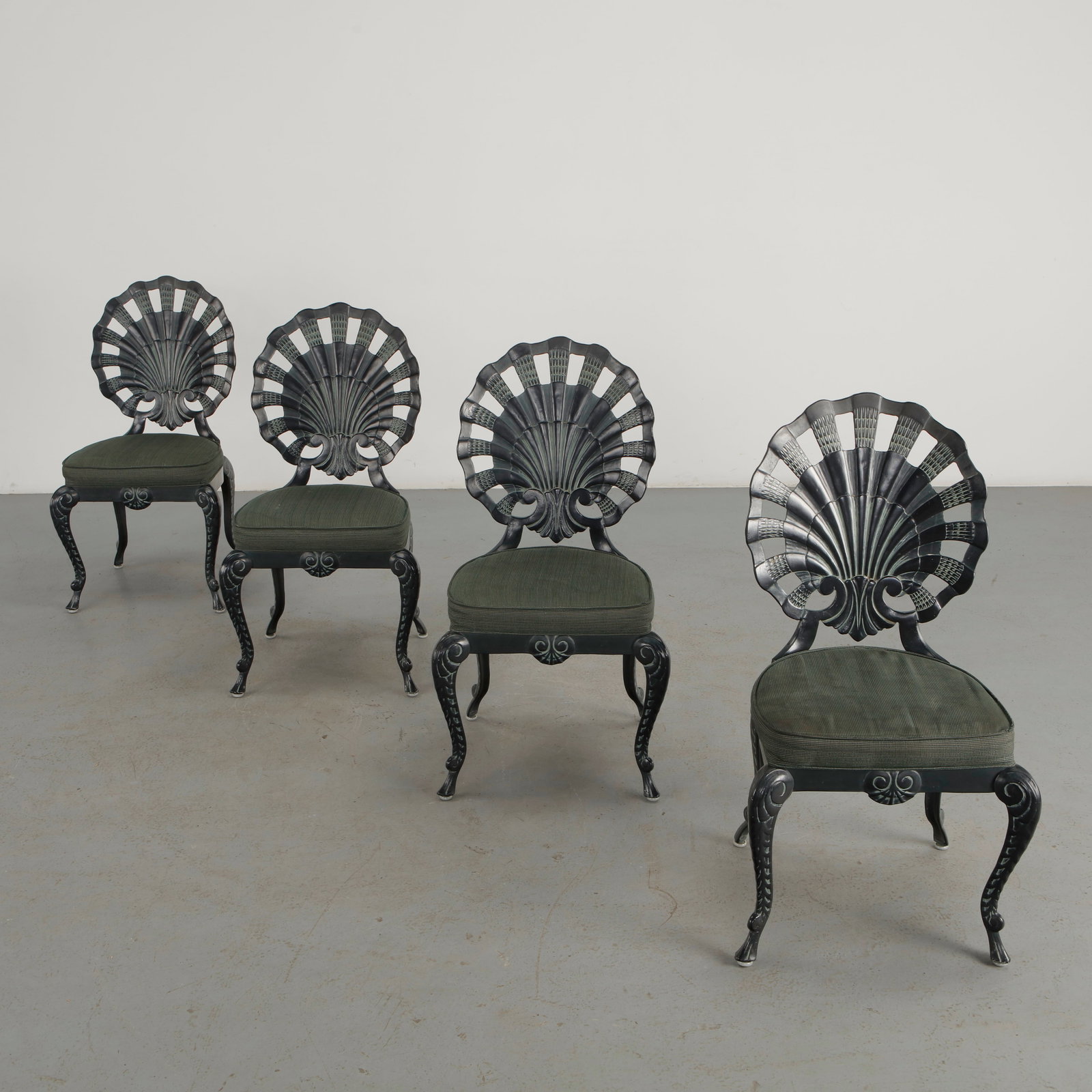 Brown Jordan, Set of Four Venetian Grotto Aluminum Shell Chairs, 1970s: A rare set of four cast aluminum shell chairs by Brown Jordan, distinguished by their dramatic scalloped backs and sculptural openwork profiles. The Venetian Grotto form embodies the exuberant Hollywo