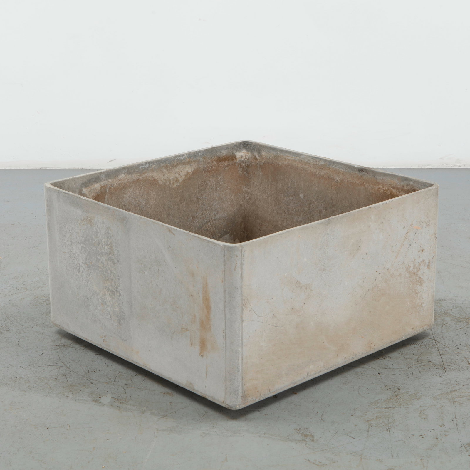 Willy Guhl, Large Square Planter, 1960s: Executed in molded concrete, this substantial planter is defined by its restrained square geometry and softly weathered surface. The monolithic form exemplifies Guhl characteristic synthesis of utilit
