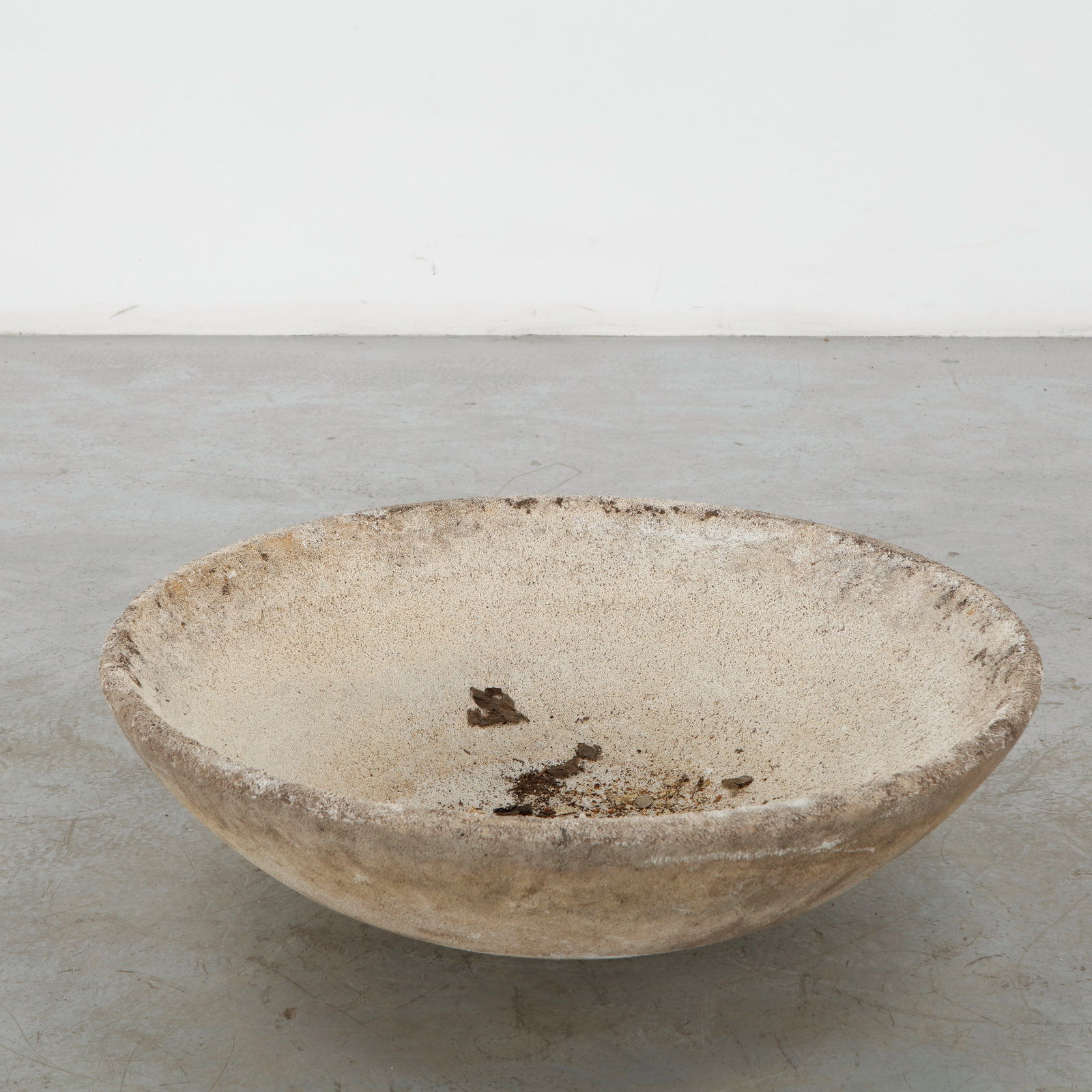 Large Cast Stone Bowl Planter, 1960s: A substantial cast stone bowl planter with a broad, softly rounded profile and finely weathered surface. Its generous proportions and restrained form lend a monumental quality to this utilitarian