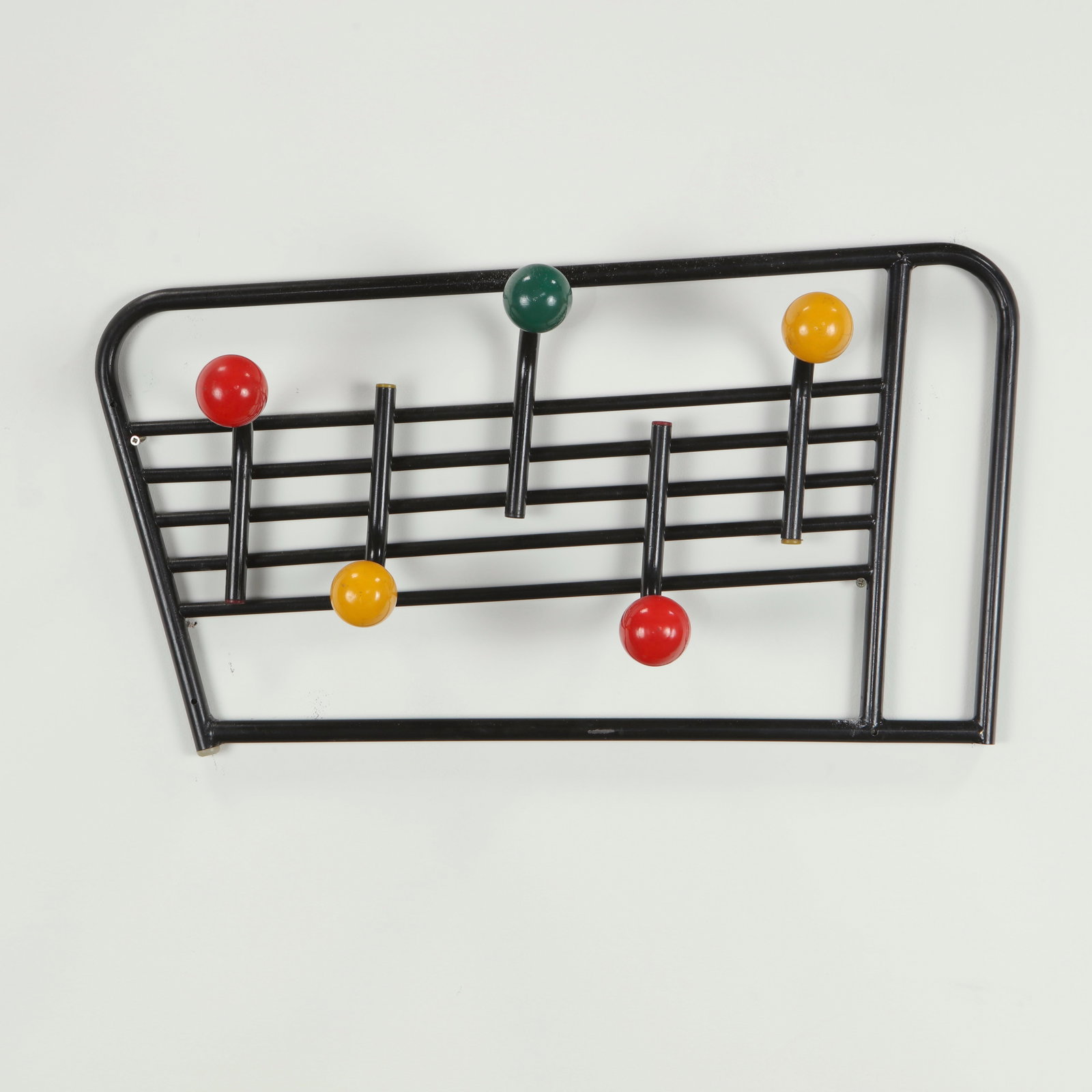 Roger Feraud, Wall Coat Rack, 1960s: A classic design by Roger Feraud, featuring a linear black metal frame punctuated by lacquered wooden spheres. This playful yet refined composition illustrates the optimism and graphic clarity of