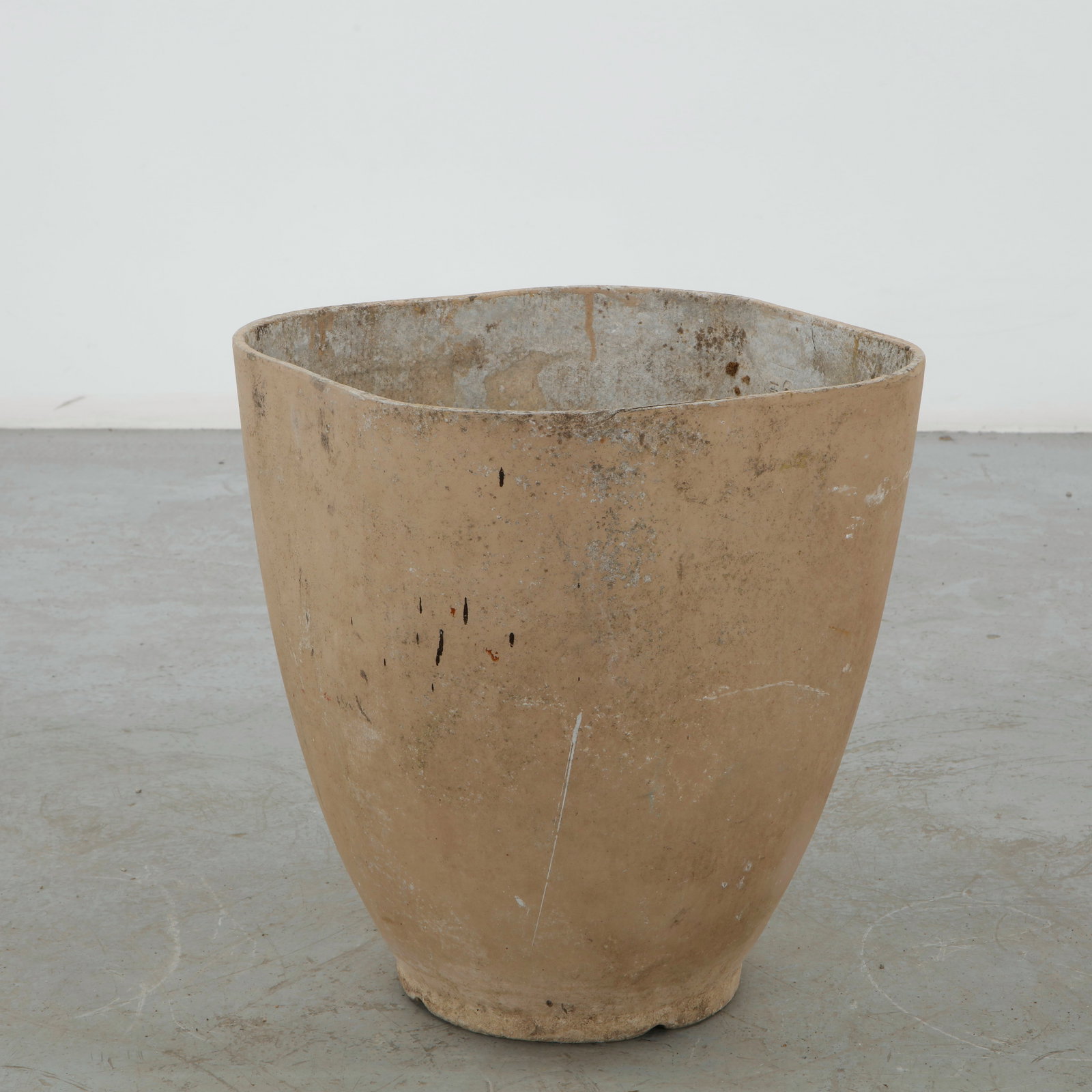 Willy Guhl, Tapered Planter, 1960s: Executed in concrete, this generously proportioned planter presents a gently tapering cylindrical form with a subtly irregular rim and integral base. Its warm aged surface and restrained silhouette