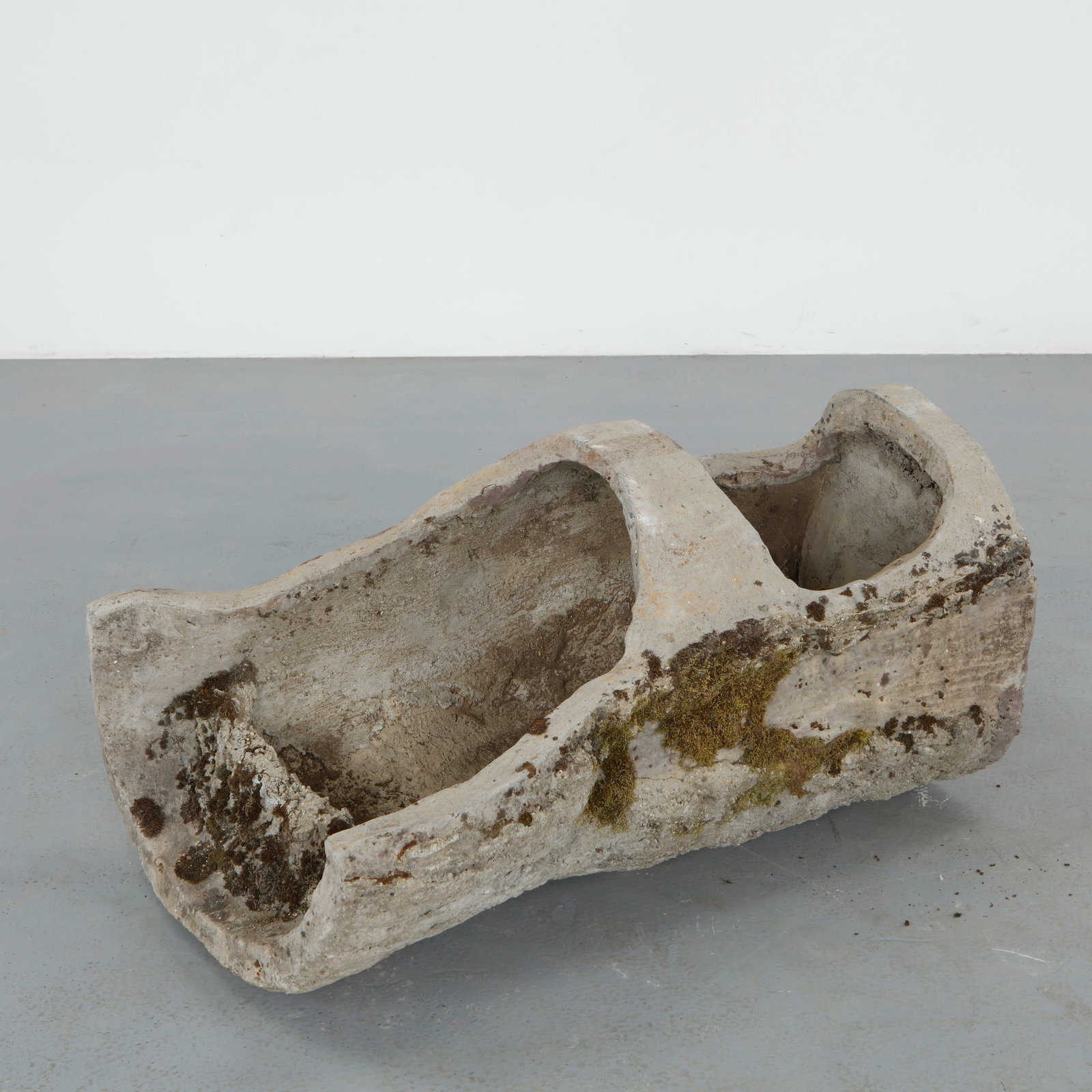 Monumental Faux Bois Log Planter, 1960s: Rare faux bois planter sculpted to resemble a natural tree trunk with a deeply carved planting reserve. Executed in concrete with richly textured surfaces and organic contours, the piece features an