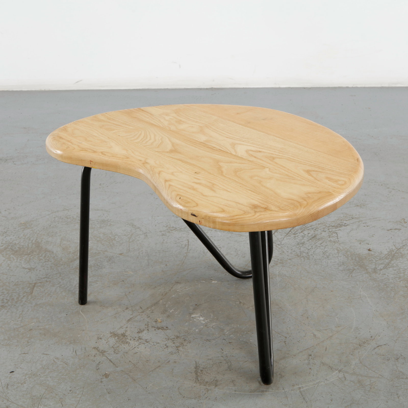 Pierre Guariche, Prefacto Table, 1950s: Crafted for Trefac Meurop, this rare Prefacto low table exemplifies Pierre Guariche refined functionalism. The biomorphic oak top rests on elegantly bent lacquered metal legs, merging organic form wit