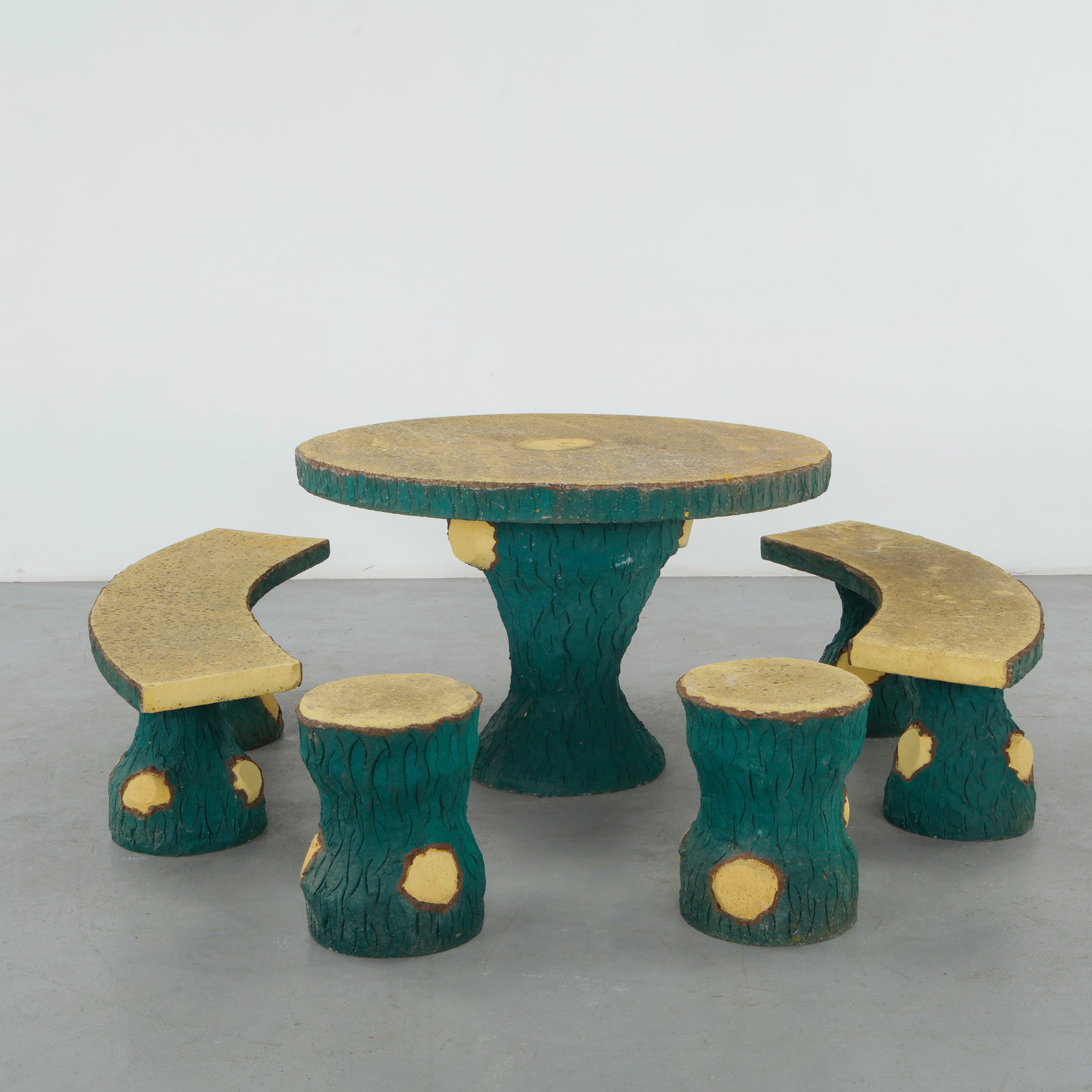 Faux Bois Outdoor Dining Set, 1960s: Faux bois outdoor dining set comprising a round table, curved benches, and stools, executed with sculpted wood-grain surfaces and contrasting painted details. A highly expressive example of mid-centur