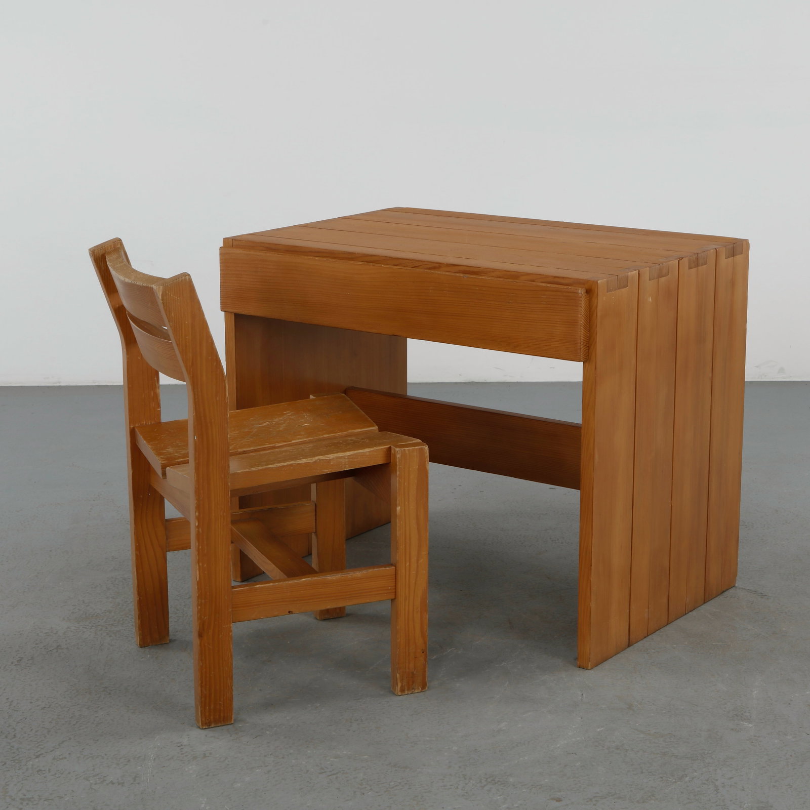 Maison Regain, Wood Desk with Matching Chair, 1960s: Constructed in solid pine, the desk features a rectilinear form with visible joinery, paired with a matching chair of complementary design. The ensemble reflects the honest materials and