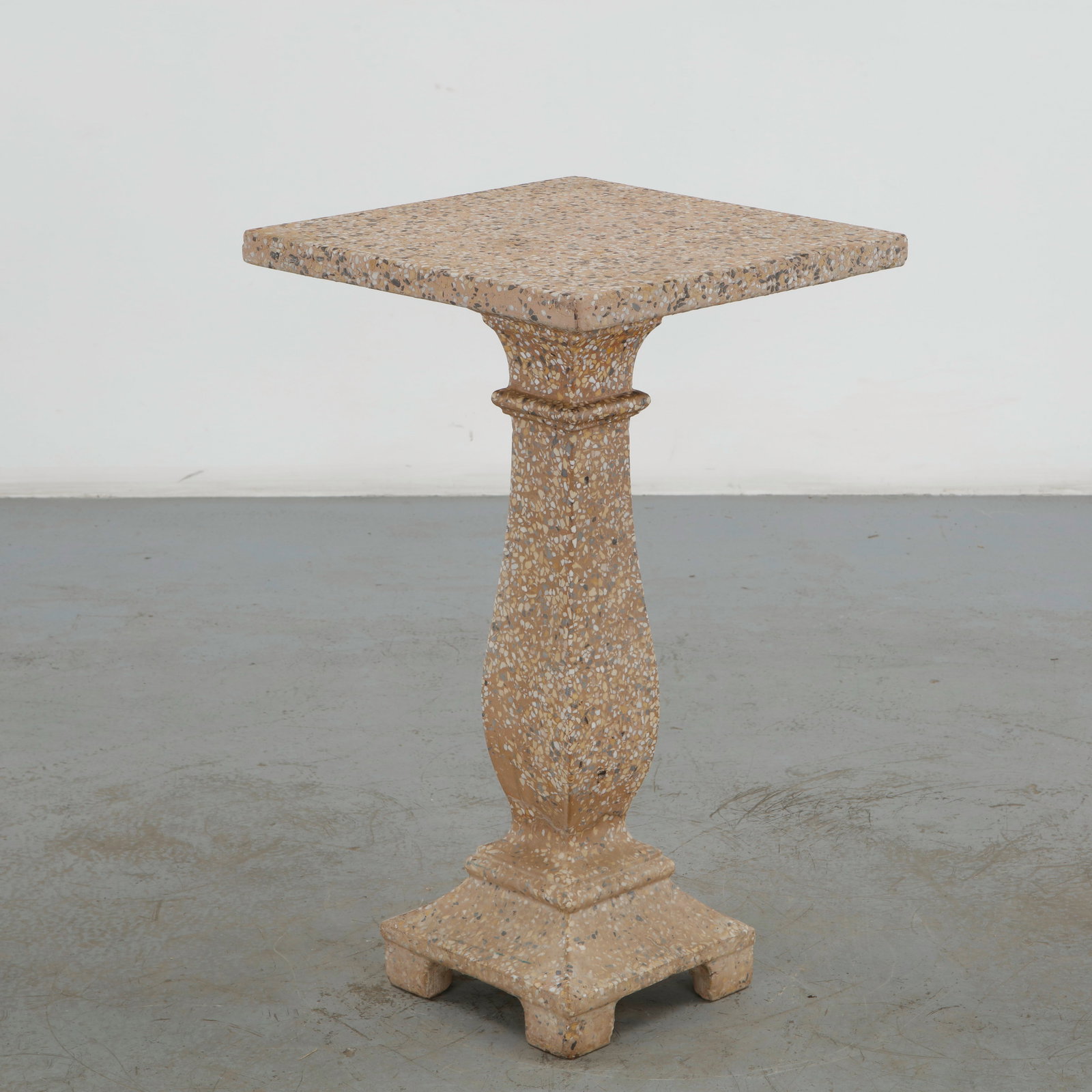 Terrazzo Pedestal, 1960s: Monumental architectural pedestal executed in richly variegated terrazzo, with a square top, sculptural column and stepped base. The refined geometric construction and aggregate surface lend the