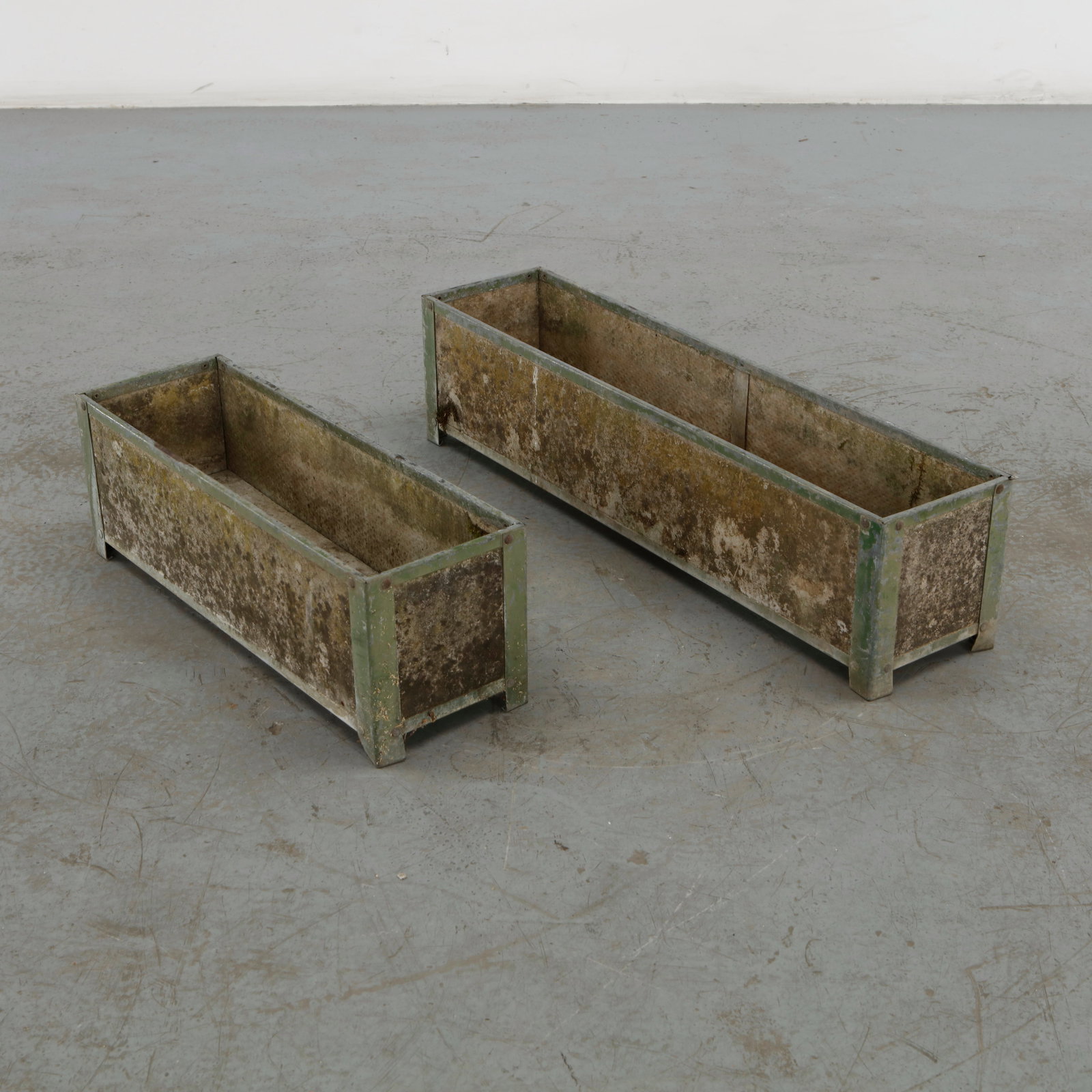 Willy Guhl, Pair of Rectangular Planters, 1960s: Rare pair of rectangular planters attributed to Willy Guhl, executed in weathered concrete with a restrained architectural form and raised structural frame. Their austere geometry and industrial
