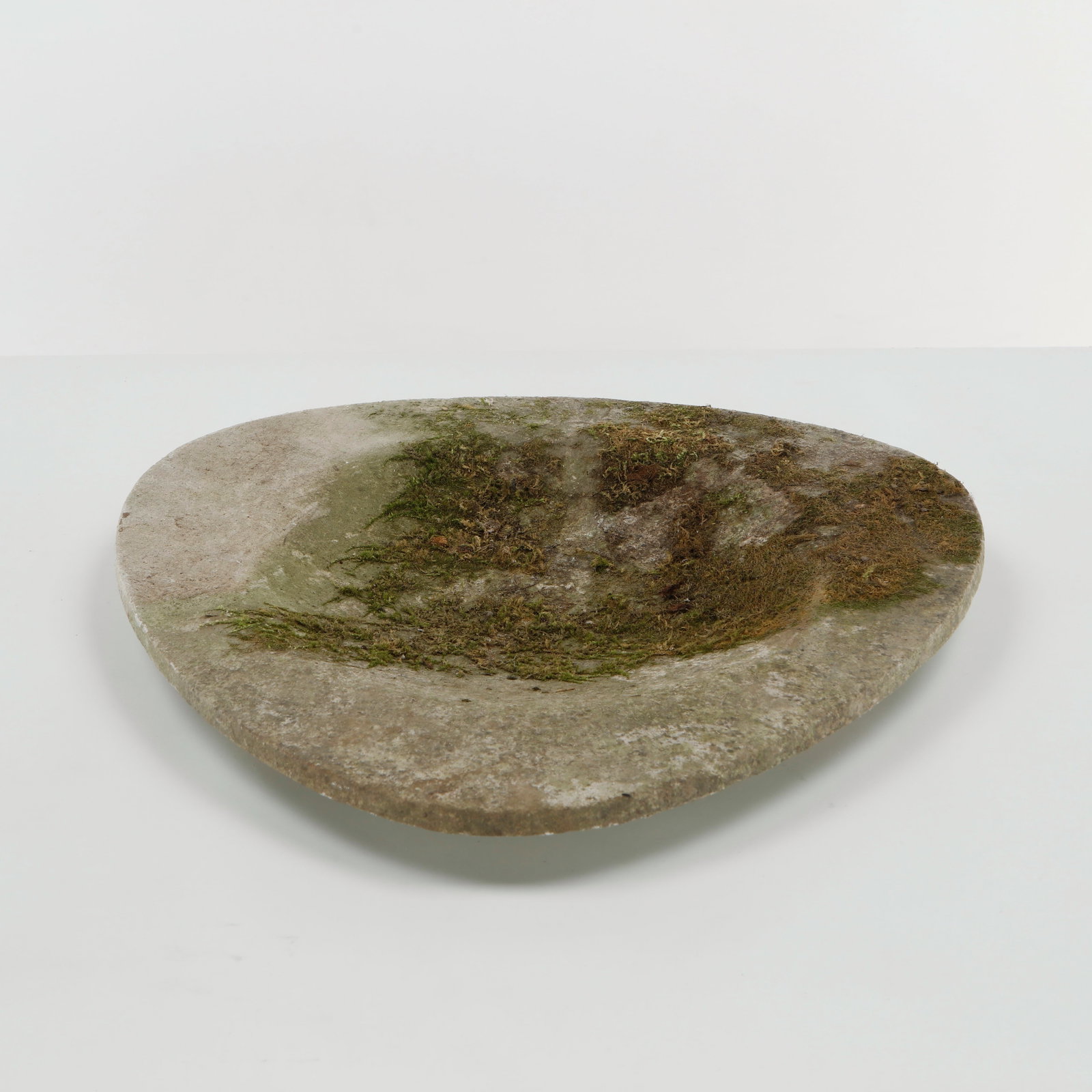 Willy Guhl, Tray Planter, 1960s: Broad concrete planter distinguished by its low, gently rounded profile and raised perimeter. The restrained geometry and weathered mineral surface exemplify Guhl celebrated approach to functional