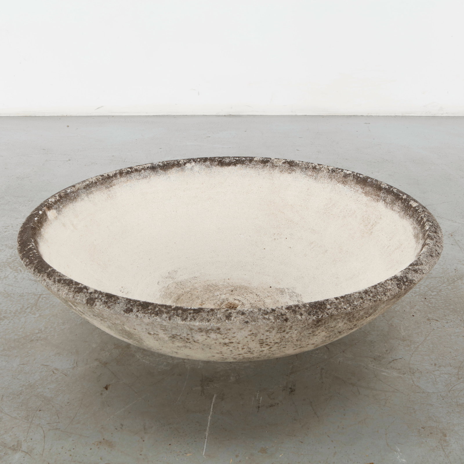 Large Cast Stone Bowl Planter, 1960s: A substantial cast stone bowl planter with a broad, softly rounded profile and finely weathered surface. Its generous proportions and restrained form lend a monumental quality to this utilitarian gard