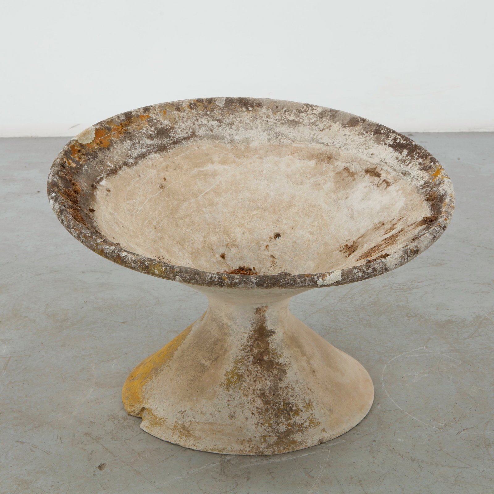 Willy Guhl, Off-Kilter Planter, 1960s: A sculptural concrete planter distinguished by its subtly irregular, off-kilter profile and asymmetrical stance. The expressive weathering of the concrete enhances its organic character while retainin