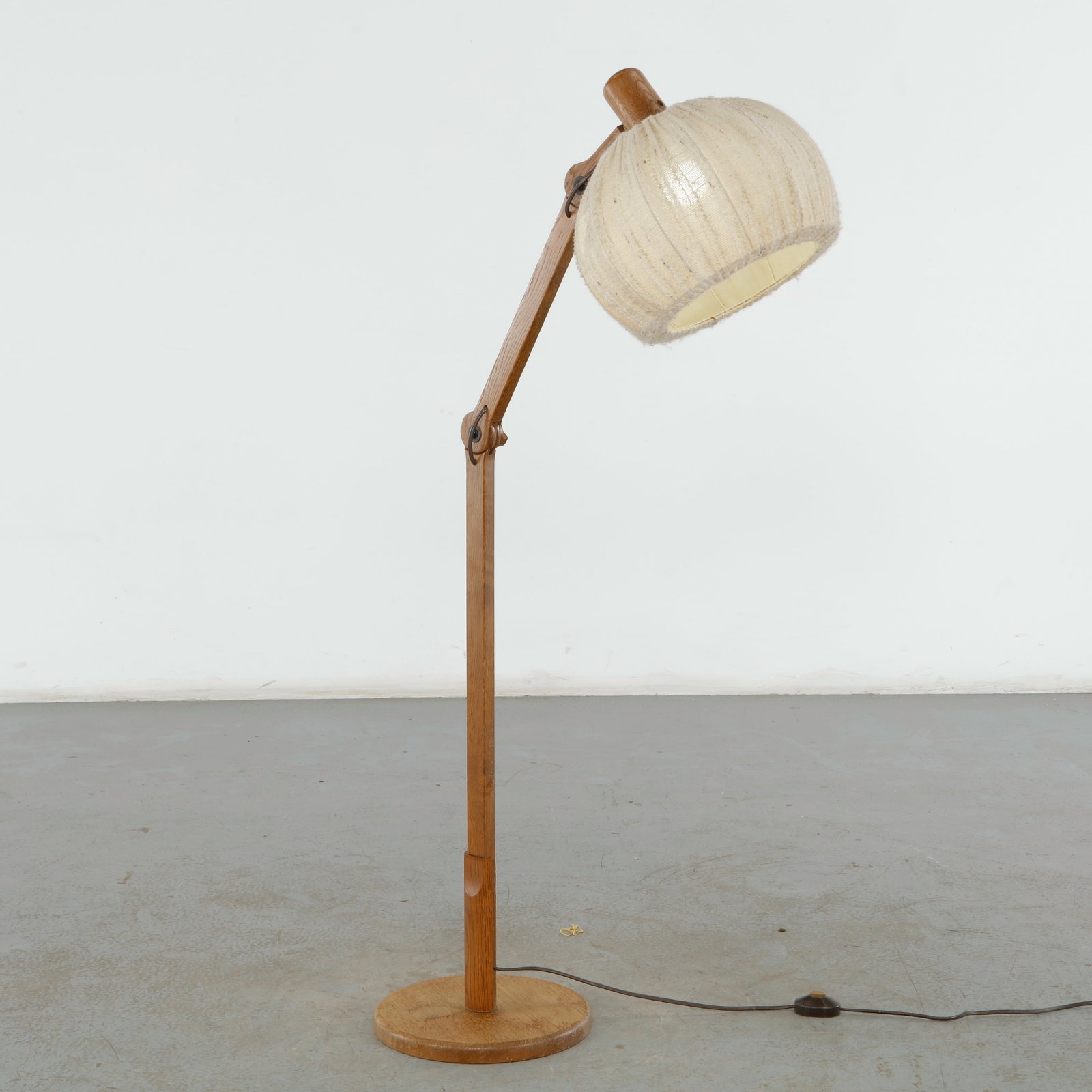 Louis Sognot, Articulated Wood and Rattan Floor Lamp, France, 1950s: This vintage French midcentury modern floor lamp represents the refined, organic modernism popularized by designer Louis Sognot during the 1950s_1960s. The piece beautifully balances a minimalist,