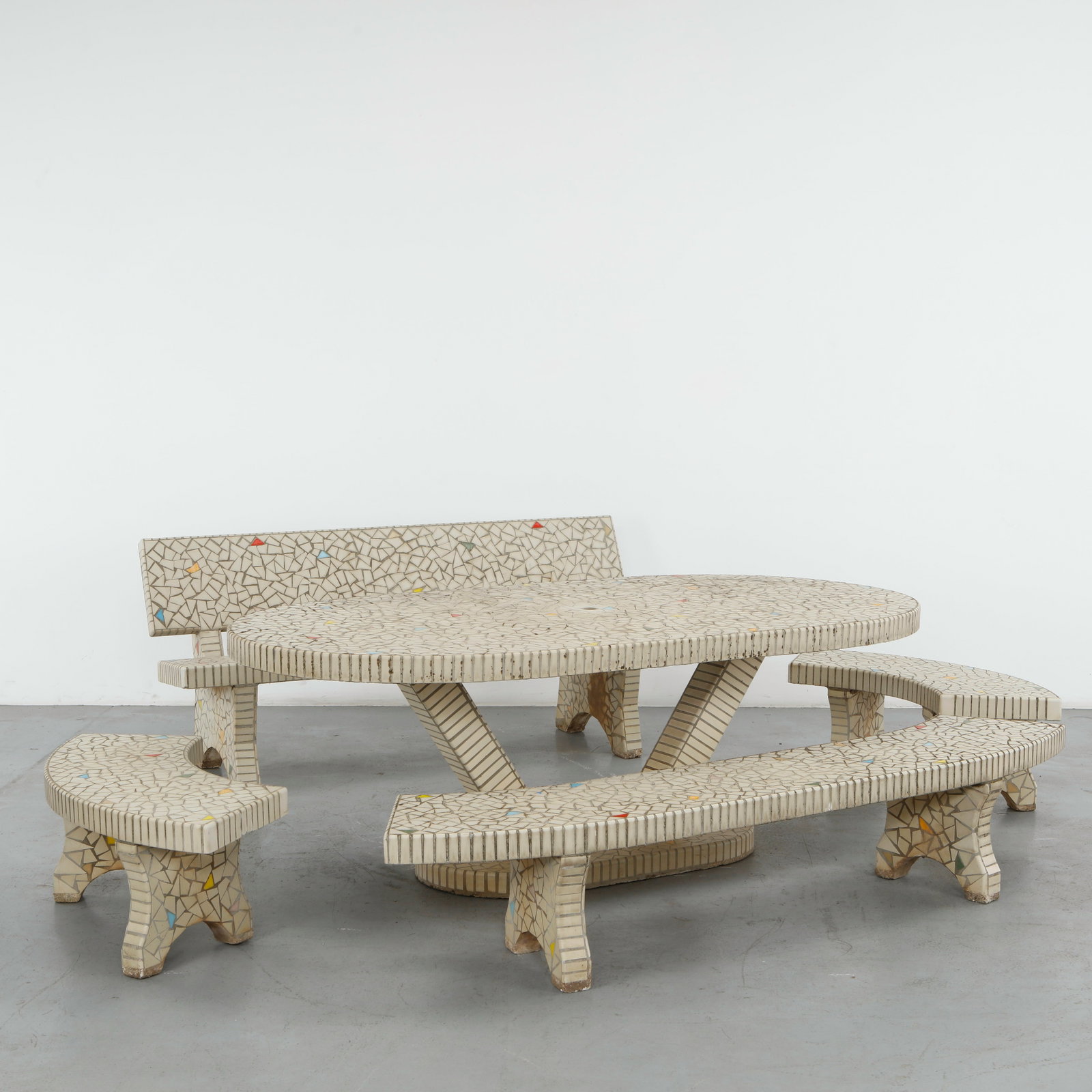 White Mosaic Garden Dining Set, 1960s: Rare white mosaic tile garden dining set comprising 4 benches including one straight-backed long bench, 3 curved benches and an oval dining table. The uniform pattern is playfully broken up by a