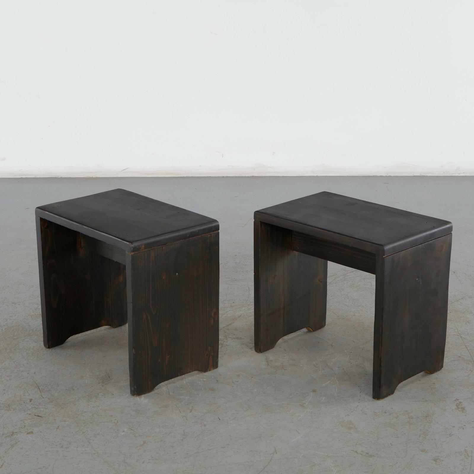 Charlotte Perriand For Les Arcs 1600, Pair of Black Pine Stools, 1960s: Pair of stools designed by acclaimed architect and designer Charlotte Perriand for the Les Arcs Ski Resort in France Savoy Alps. Height: 17 in. Width: 18 in. Depth: 12 in. Condition 