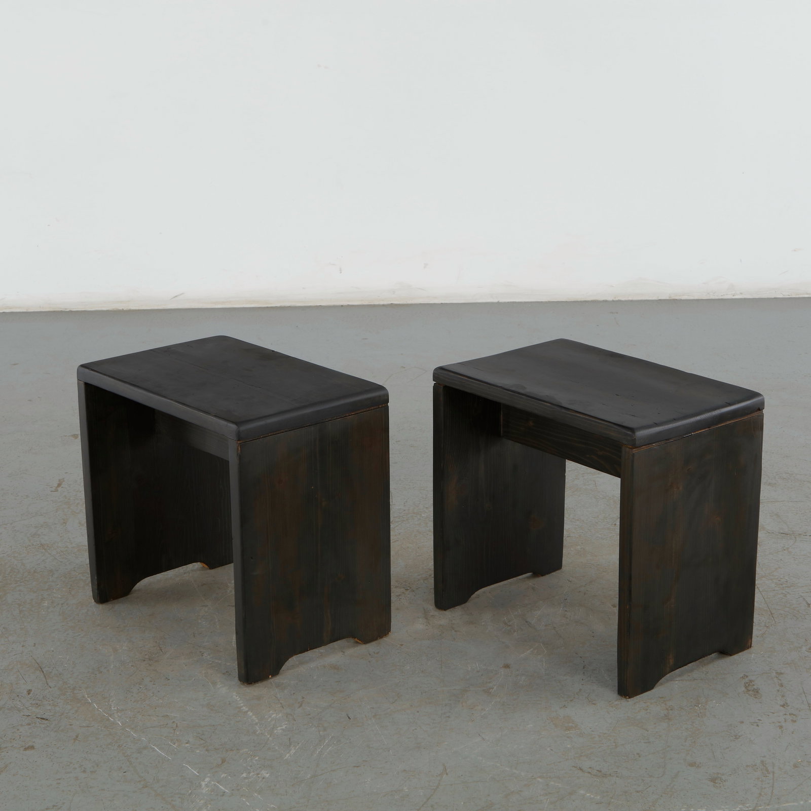 Charlotte Perriand For Les Arcs 1600, Pair of Black Pine Stools, 1960s: Pair of stools designed by acclaimed architect and designer Charlotte Perriand for the Les Arcs Ski Resort in France Savoy Alps. Height: 17 in. Width: 18 in. Depth: 12 in. Condition 
