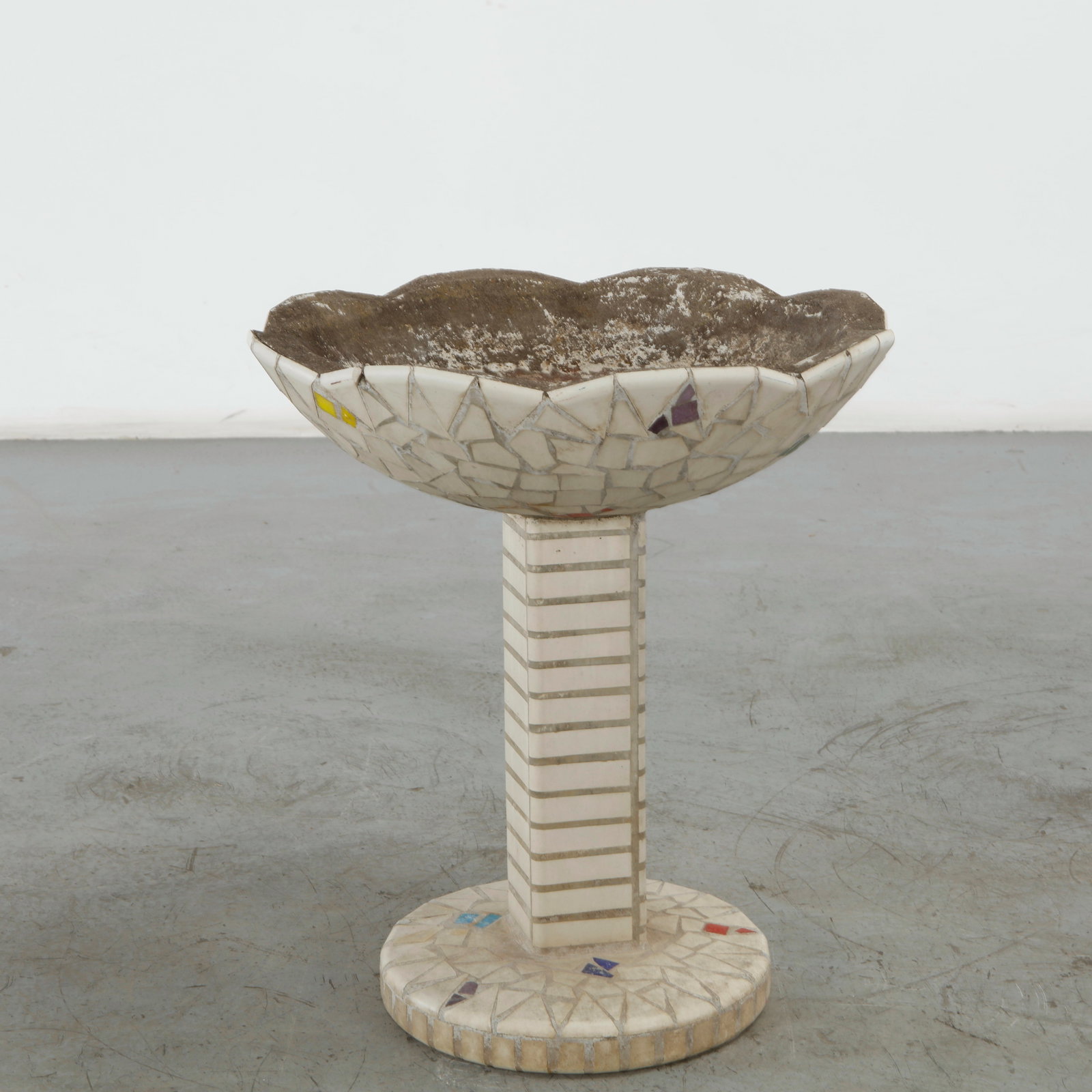 Mosaic Tile Pedestal Foutain, 1960s: This mosaic tile pedestal fountain features a unique folk art and modernist style reminiscent of pique-assiette or Gaud?-inspired design and highly sought after for eclectic garden spaces. Height: