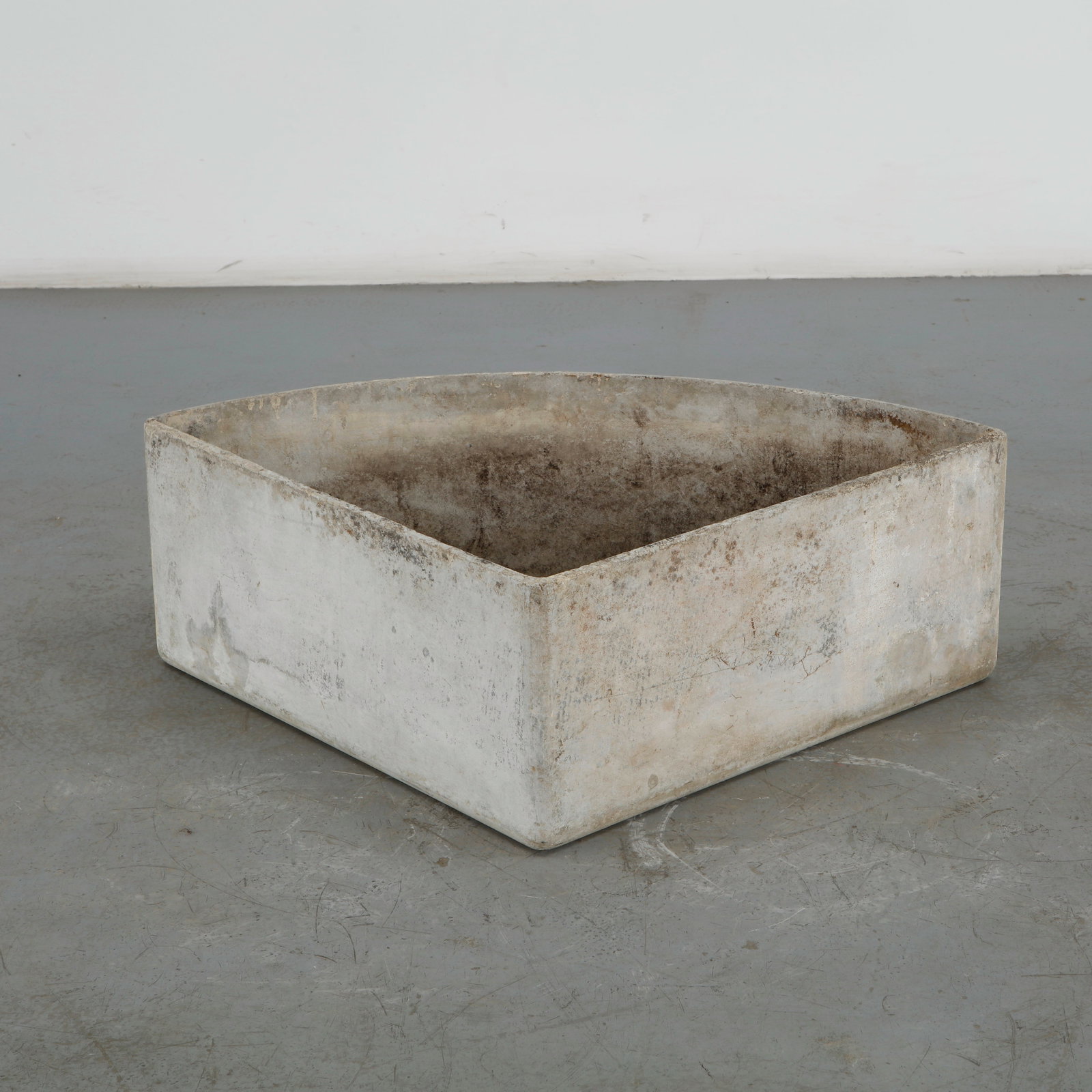 Willy Guhl, Large Pie Piece Planter, 1960s: This large triangular pie piece planter created by architect Willy Guhl for Eternit is a monumental example of mid-century Swiss industrial design. Height: 12 in. Length: 38 in. Width: 27 in.
