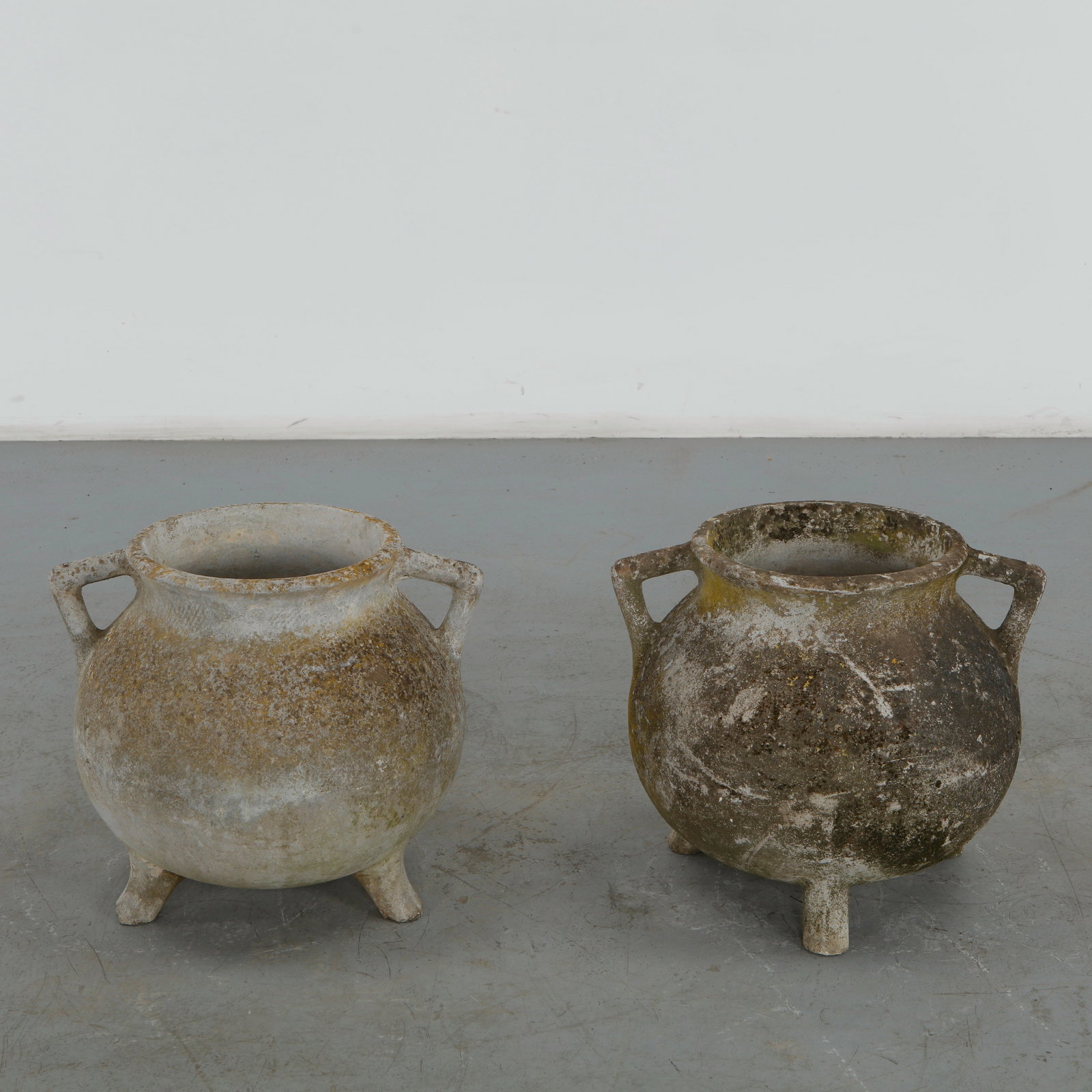 Willy Guhl, Pair of Cauldron Planters, 1960s: Rare cauldron planters by Willy Guhl, with rounded vessel-like shapes and strong sculptural presence. Aged surface adds rustic charm. Opening Diameter: 11.5 in. Overall Diameter: 21 in. Height: 18