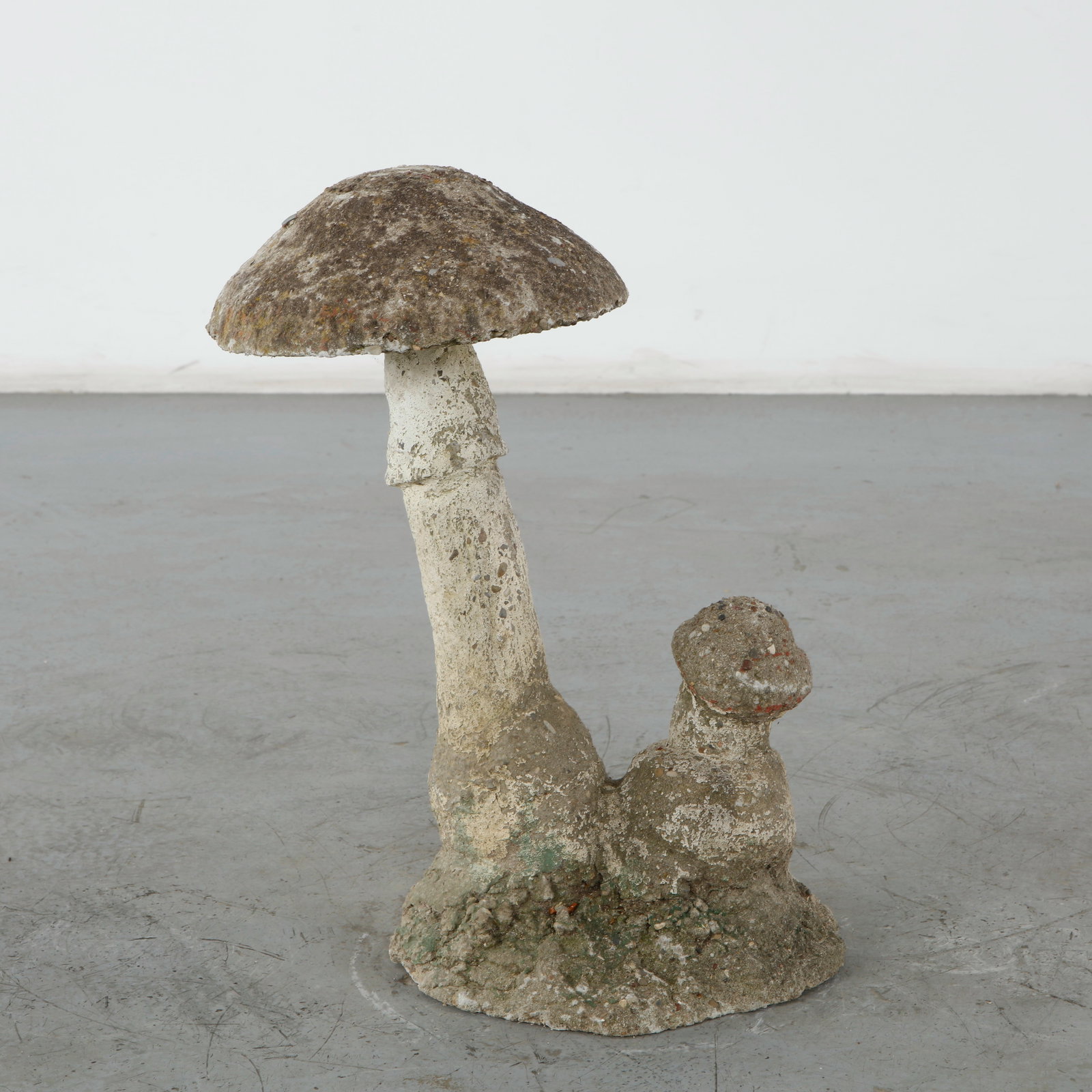 Concrete Mushroom Garden sculpture, 1960s: This vintage concrete mushroom garden sculpture, crafted in the 1960s, is a charming example of mid-century whimsical outdoor art, capturing a naturalistic aesthetic. Height: 21.5 in. Length: 18 in. W