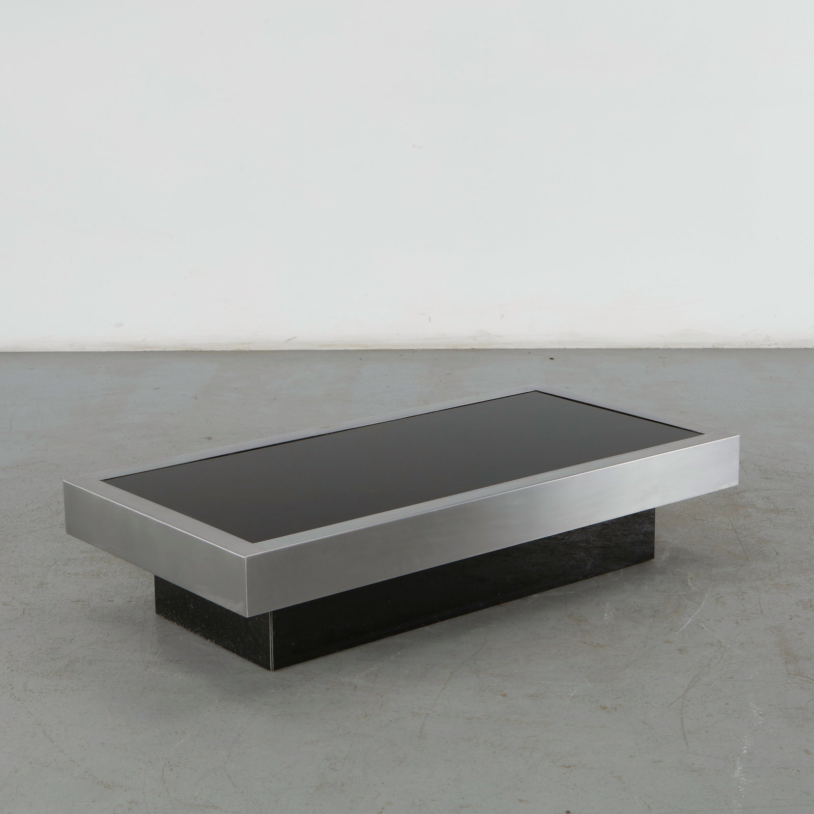Willy Rizzo, Rectangular Stainsteel Coffee Table, 1960s: This rectangular coffee table by Willy Rizzo is a premier example of 1970s Hollywood Regency and Italian modernist design. This specific piece perfectly captures the signature glamorous, low-profile l